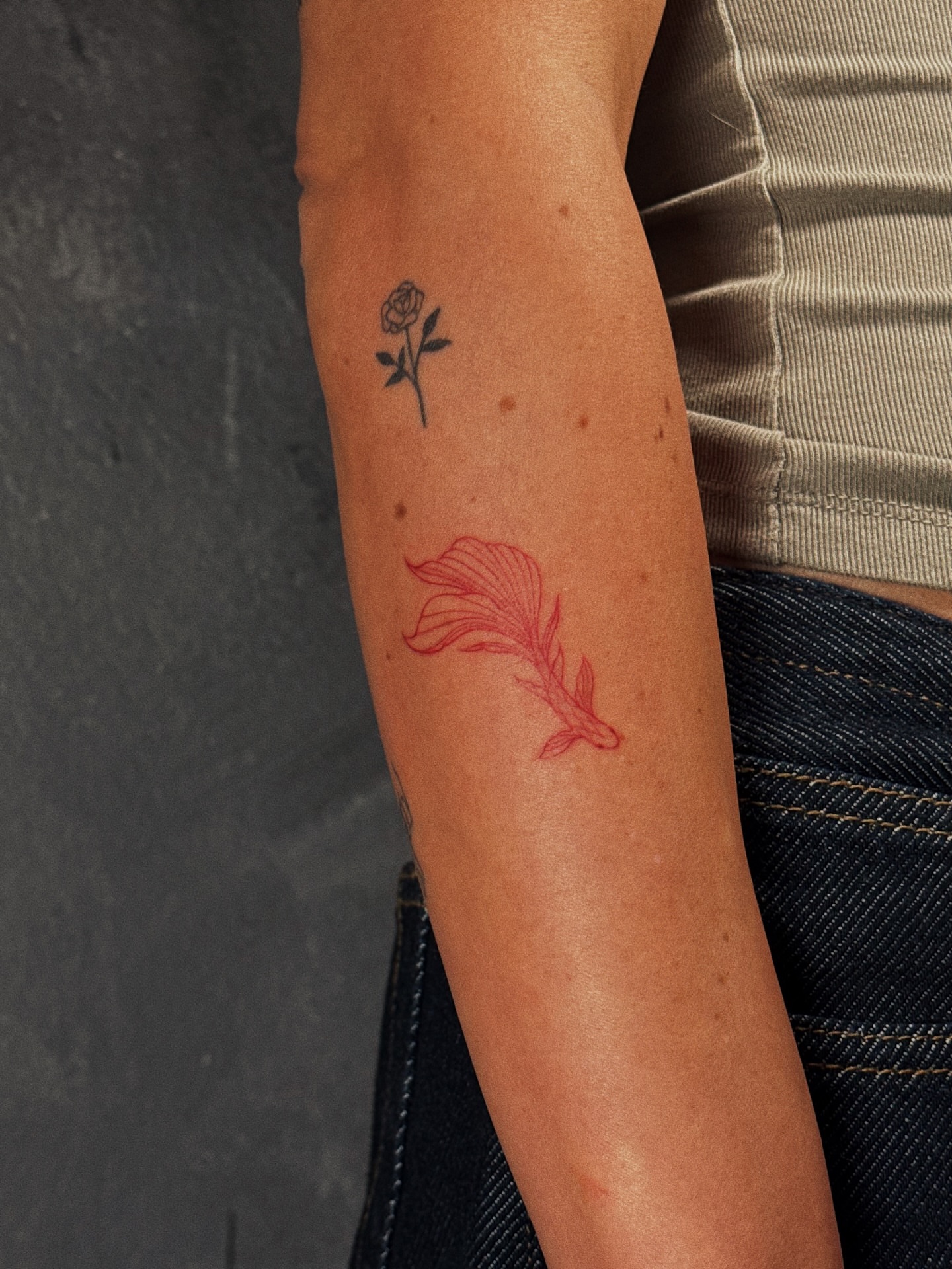 Goldfish dotwork tattoo on the forearm by Luisa Duarte