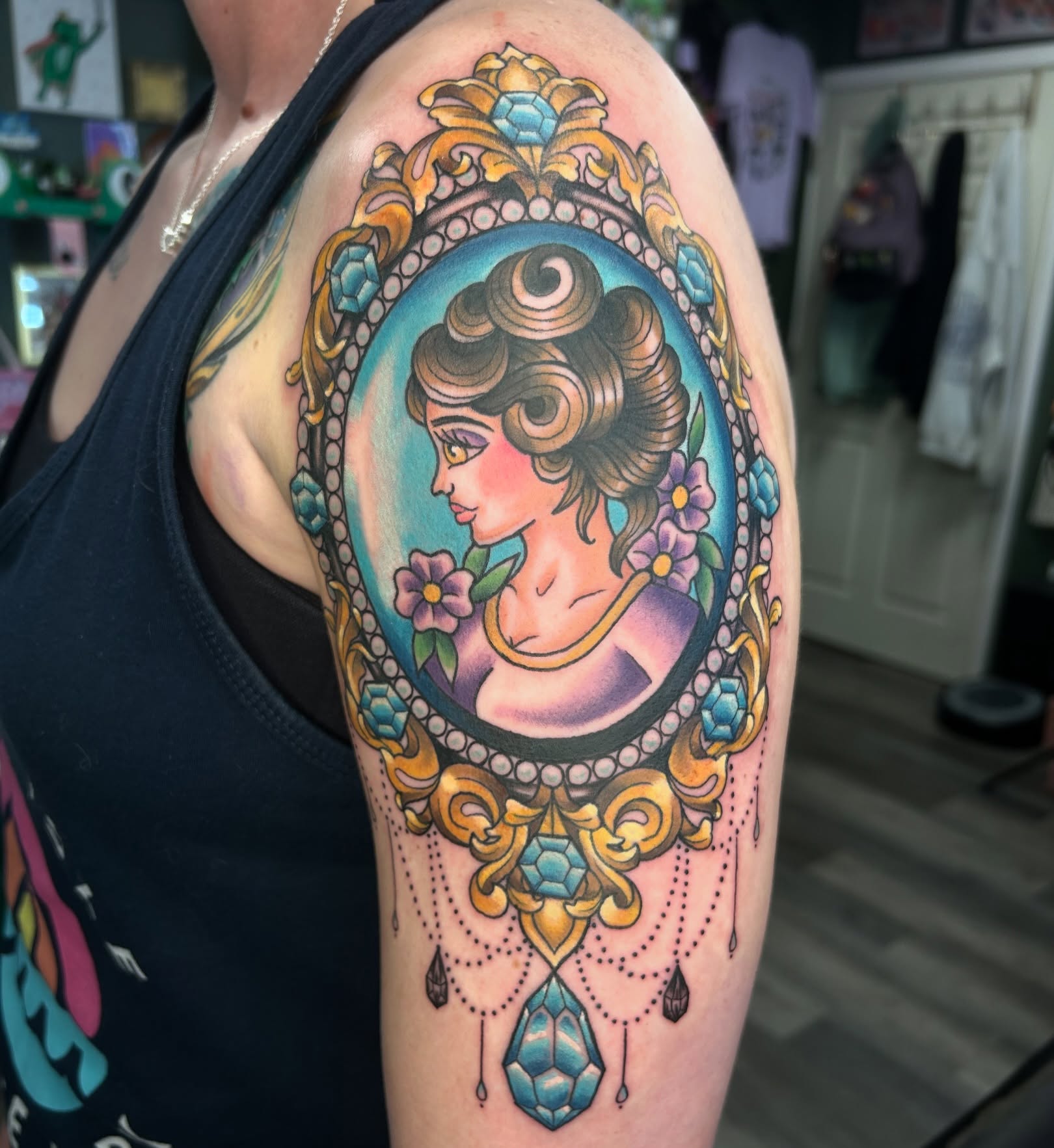 Portrait in cameo American traditional tattoo on the upper arm by Audrey Migitsch