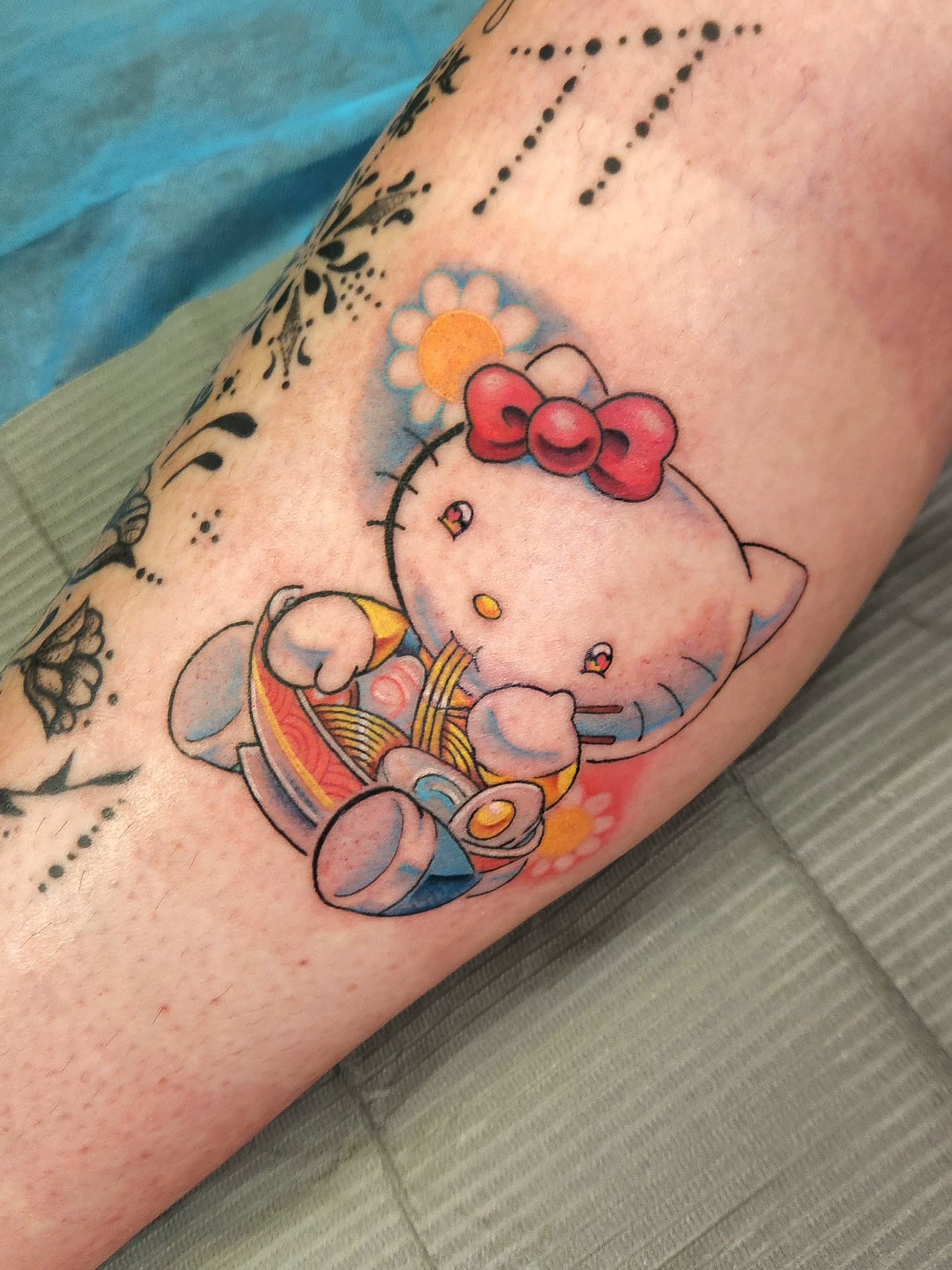 Hello Kitty dotwork tattoo on the forearm by Elizabeth Stepp