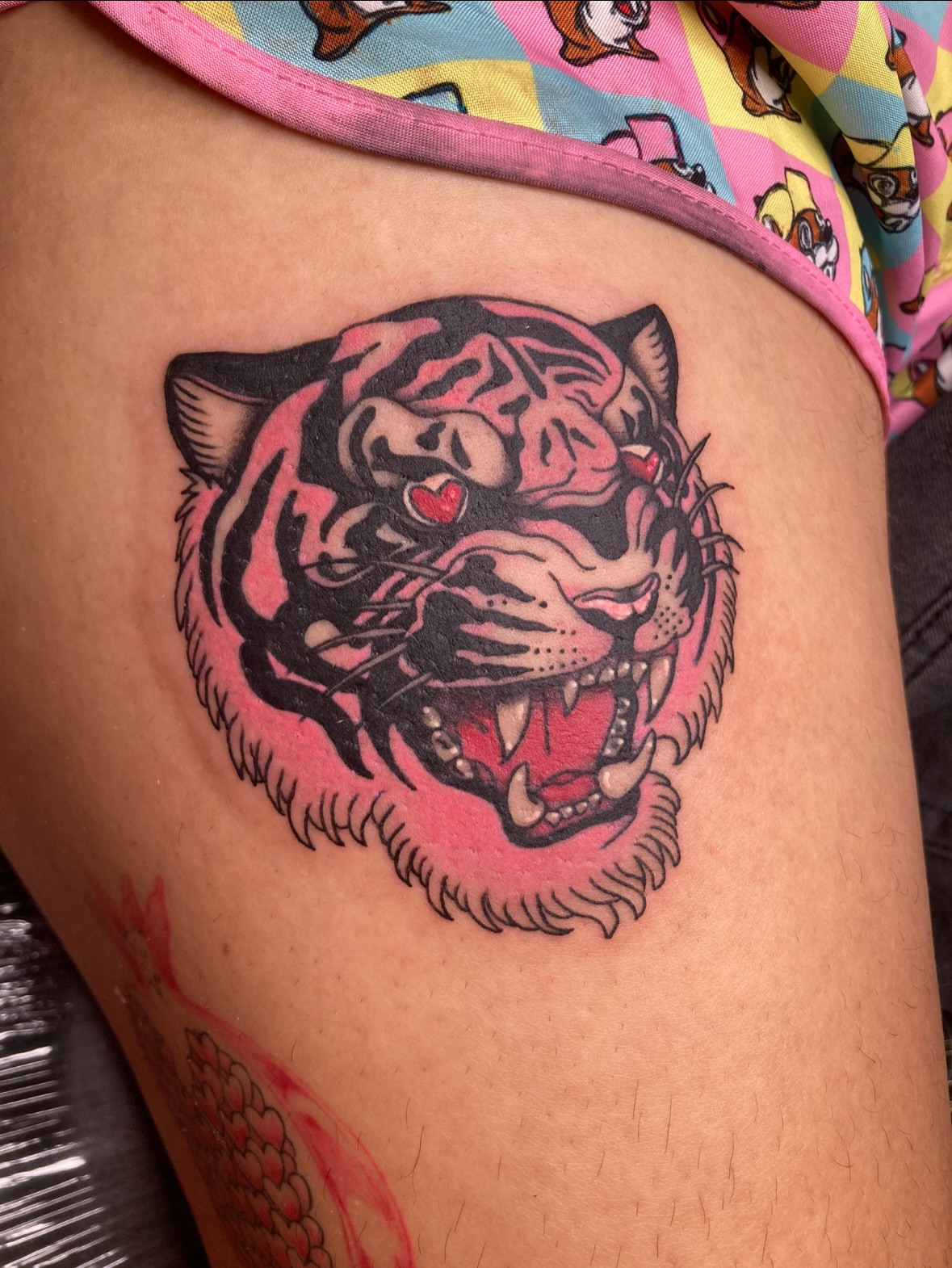 Tiger American traditional tattoo on the thigh by Ash Nicole Painterly, San Diego, California