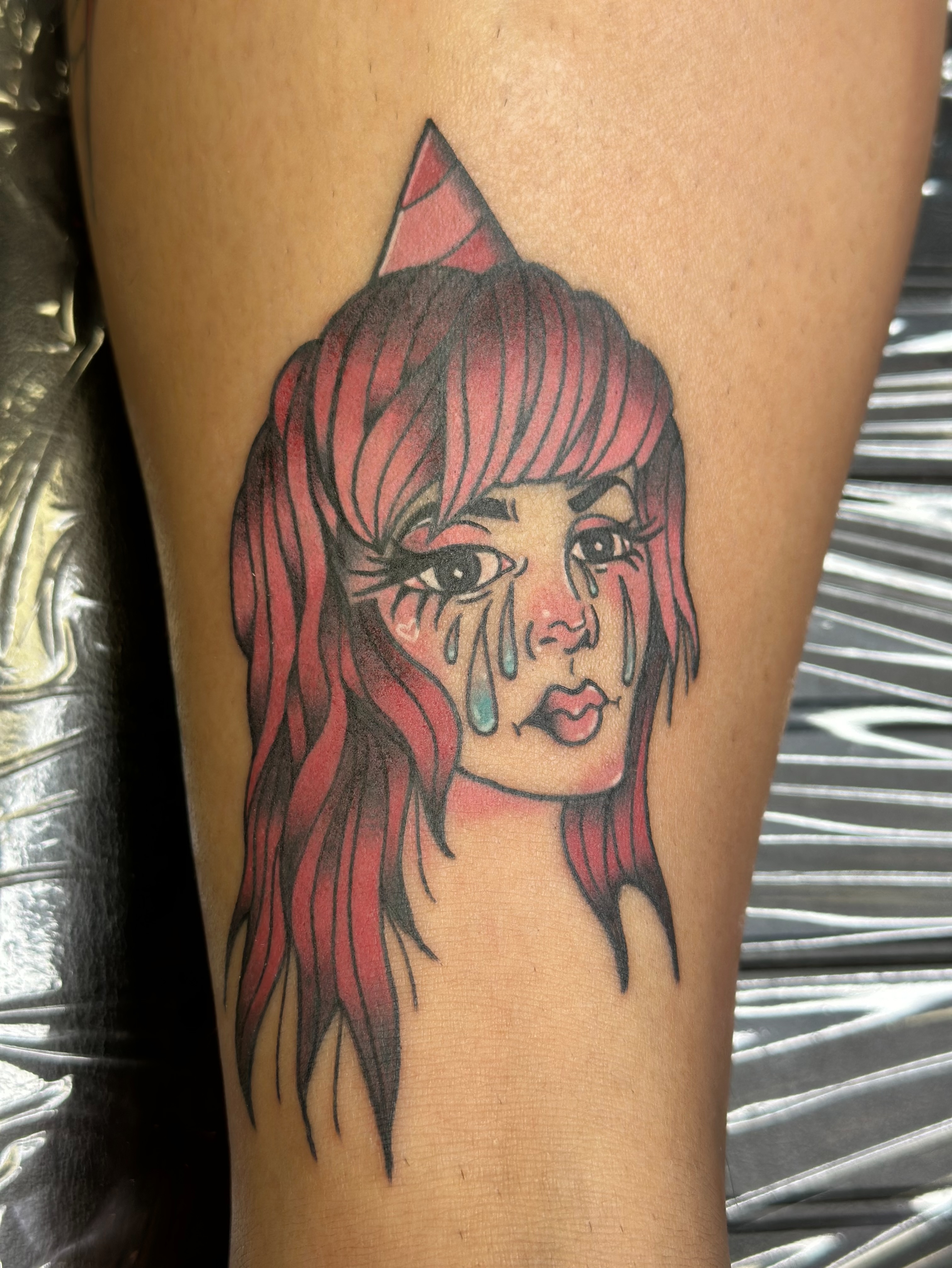 Woman with tears realism tattoo on the forearm by Ash Nicole Painterly, San Diego, California