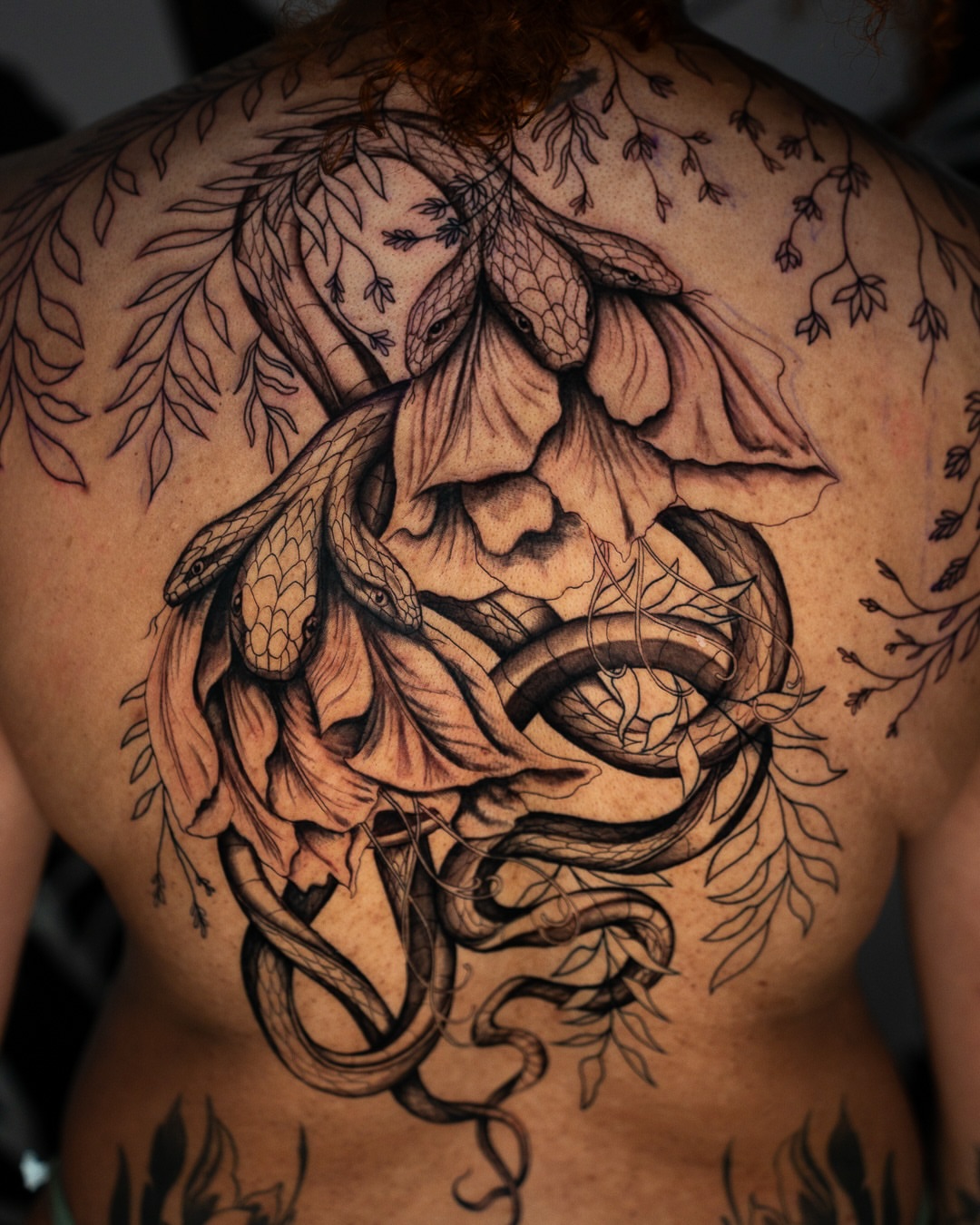 Snake and peony realism tattoo on the back by Tattoo Artist Bay Area - Lorenzo, Berkeley, California