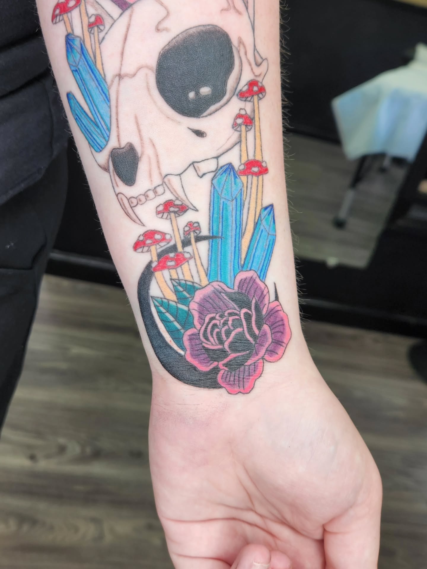 Skull and crystal neo-traditional tattoo on the forearm by Jessica Duggan