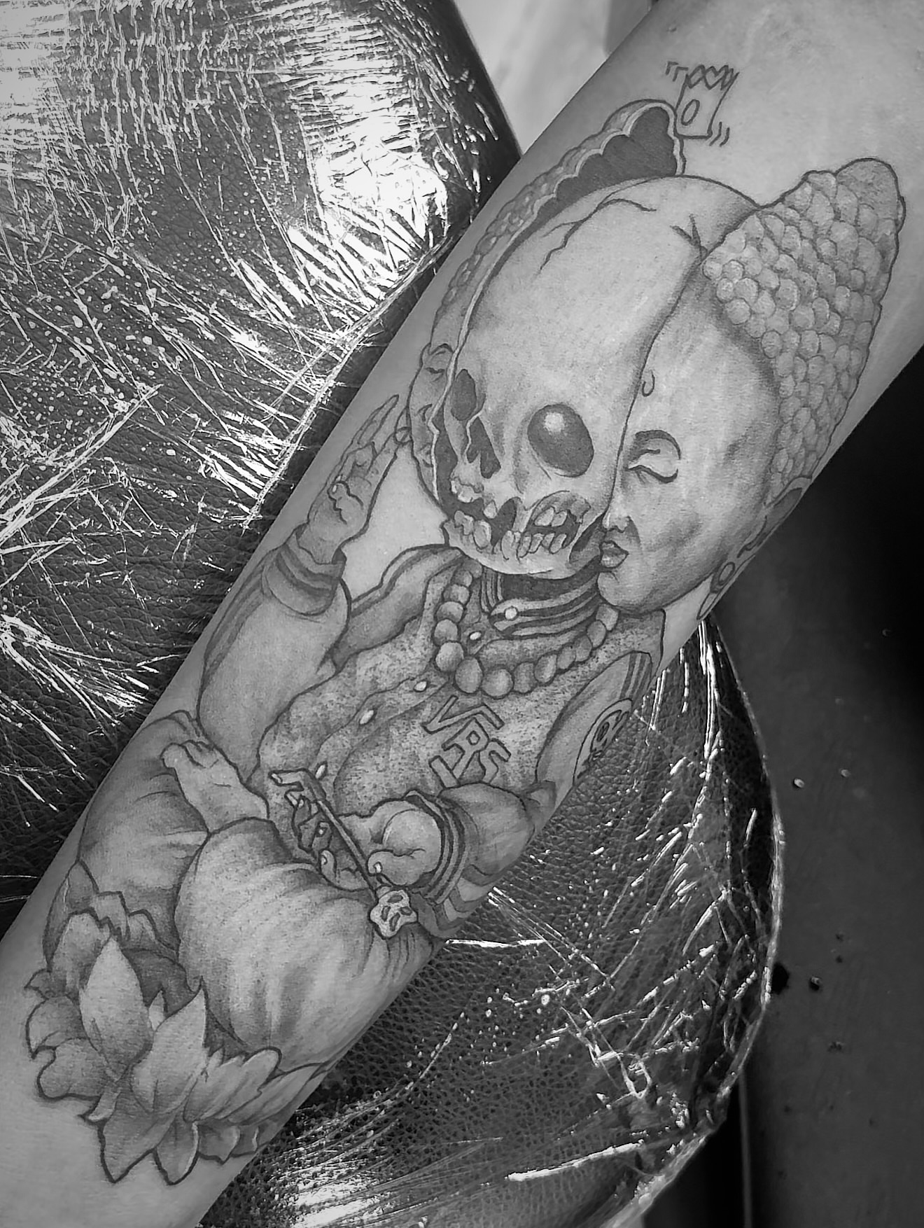 Baby with skull realism tattoo on the forearm by Vrs tattoo