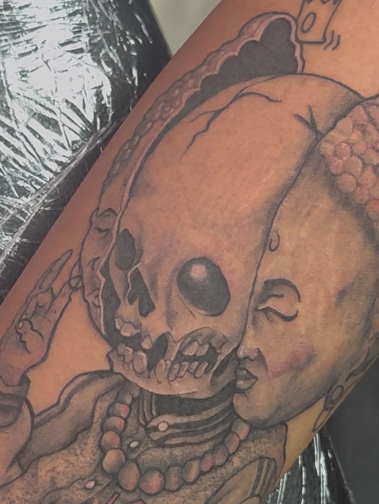 Skull and woman American traditional tattoo on the forearm by Vrs tattoo
