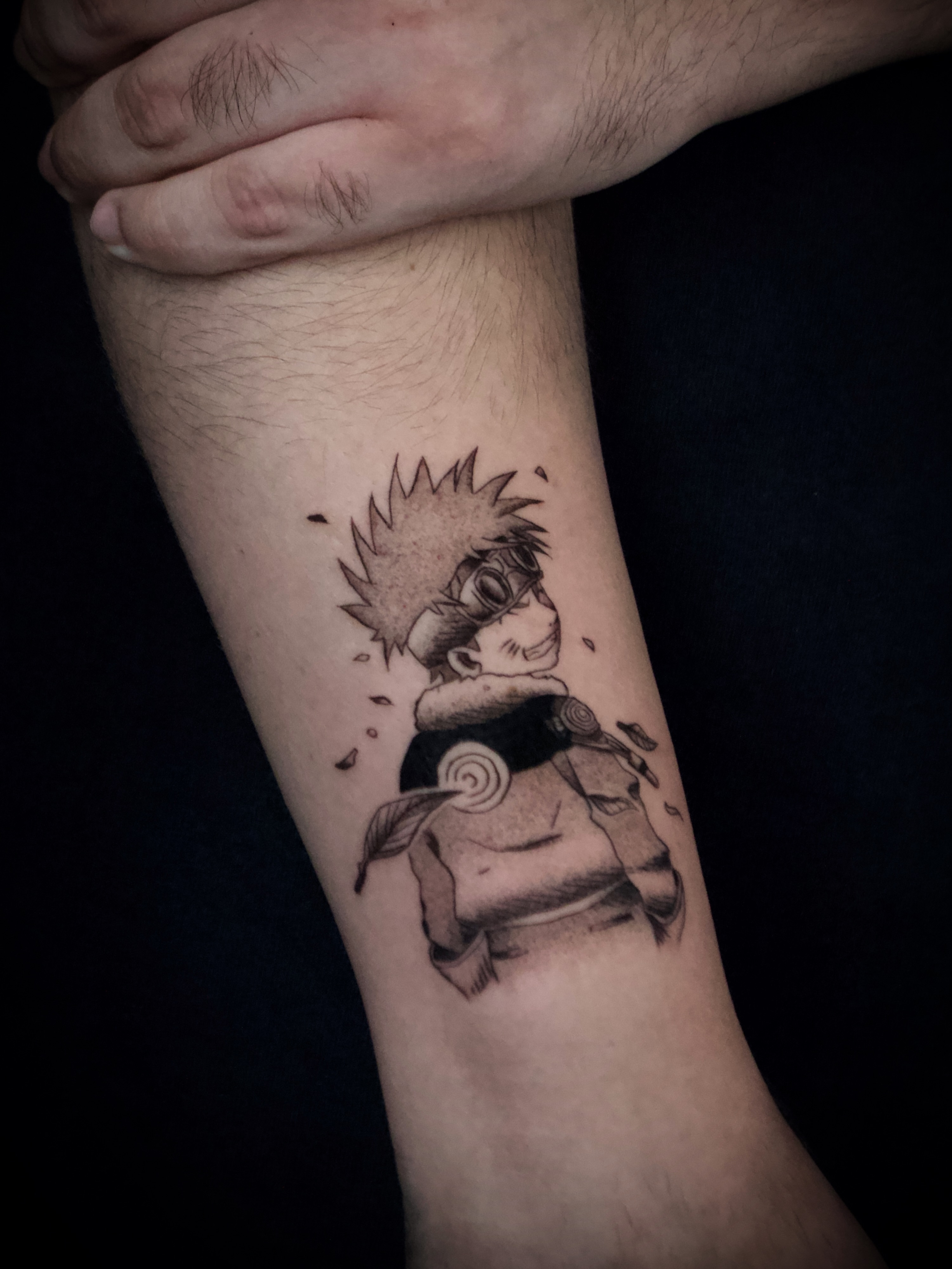Anime character black and grey tattoo on the forearm by Kanya, Alhambra, California