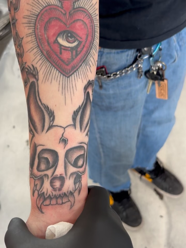 Heart with eye American traditional tattoo on the forearm by Miklo Montoya