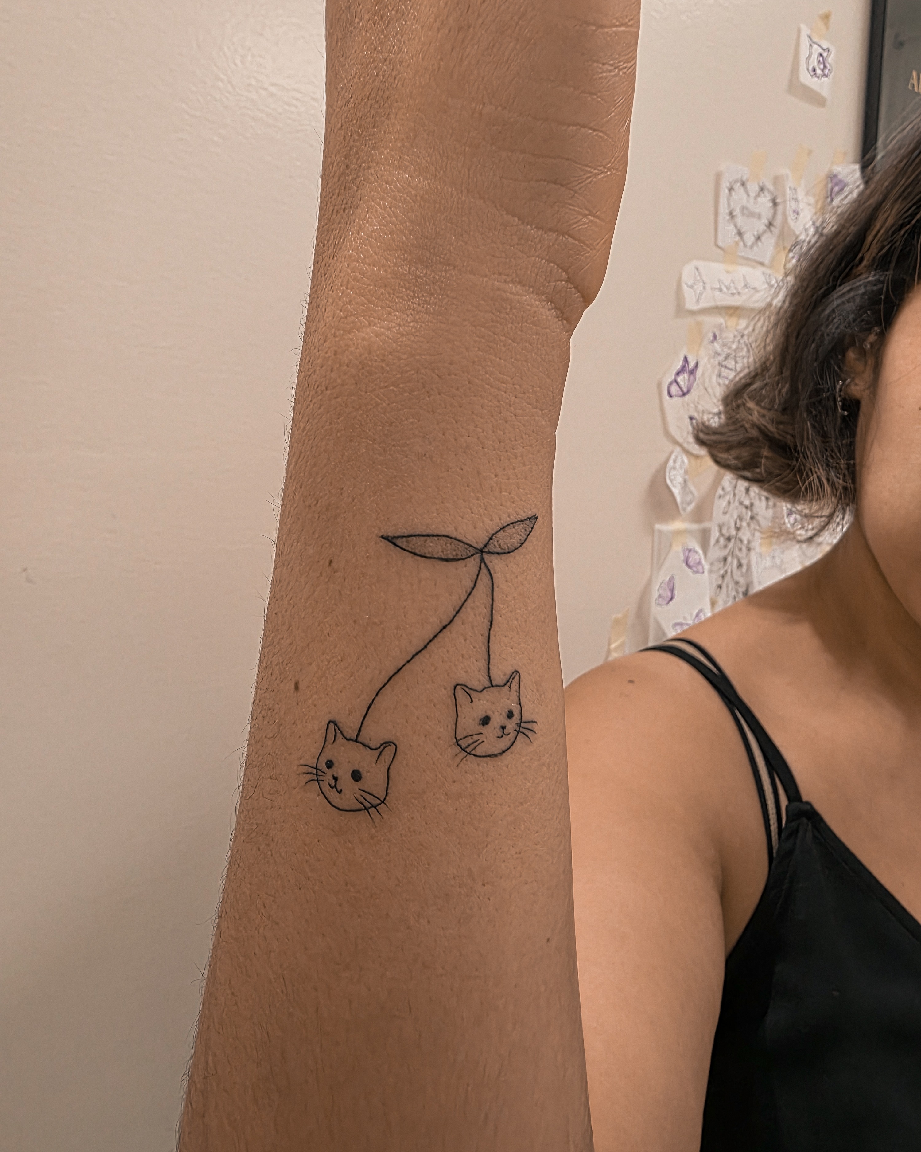 Two cats fine line tattoo on the forearm by Richmond tattoo shop, Richmond, Texas