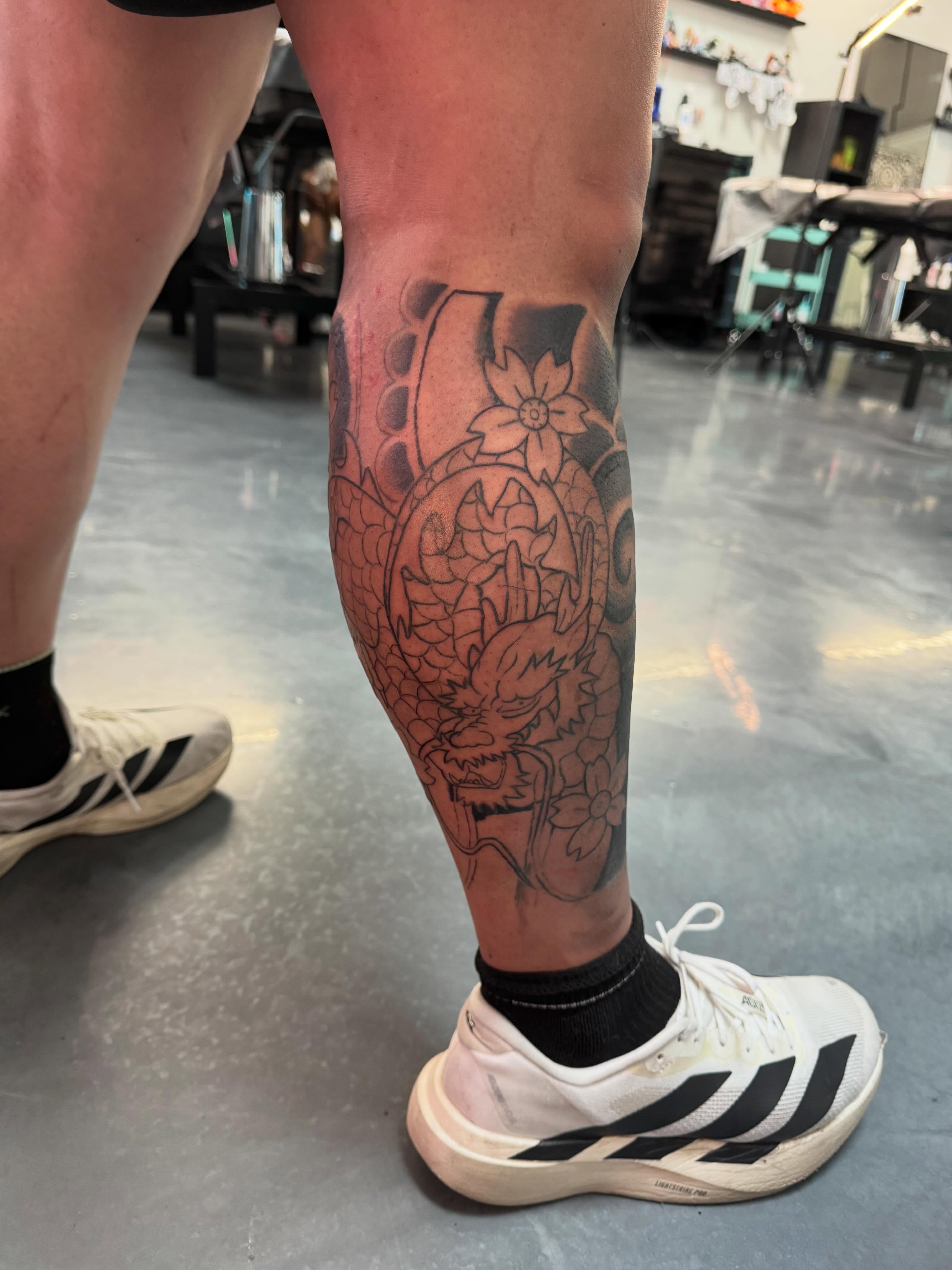 Dragon and flowers japanese irezumi tattoo on the calf by Bunny 🐰