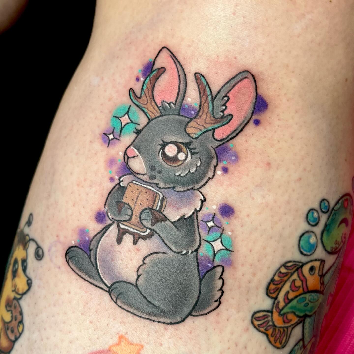 Rabbit watercolor tattoo on the thigh by Ash Wheeler