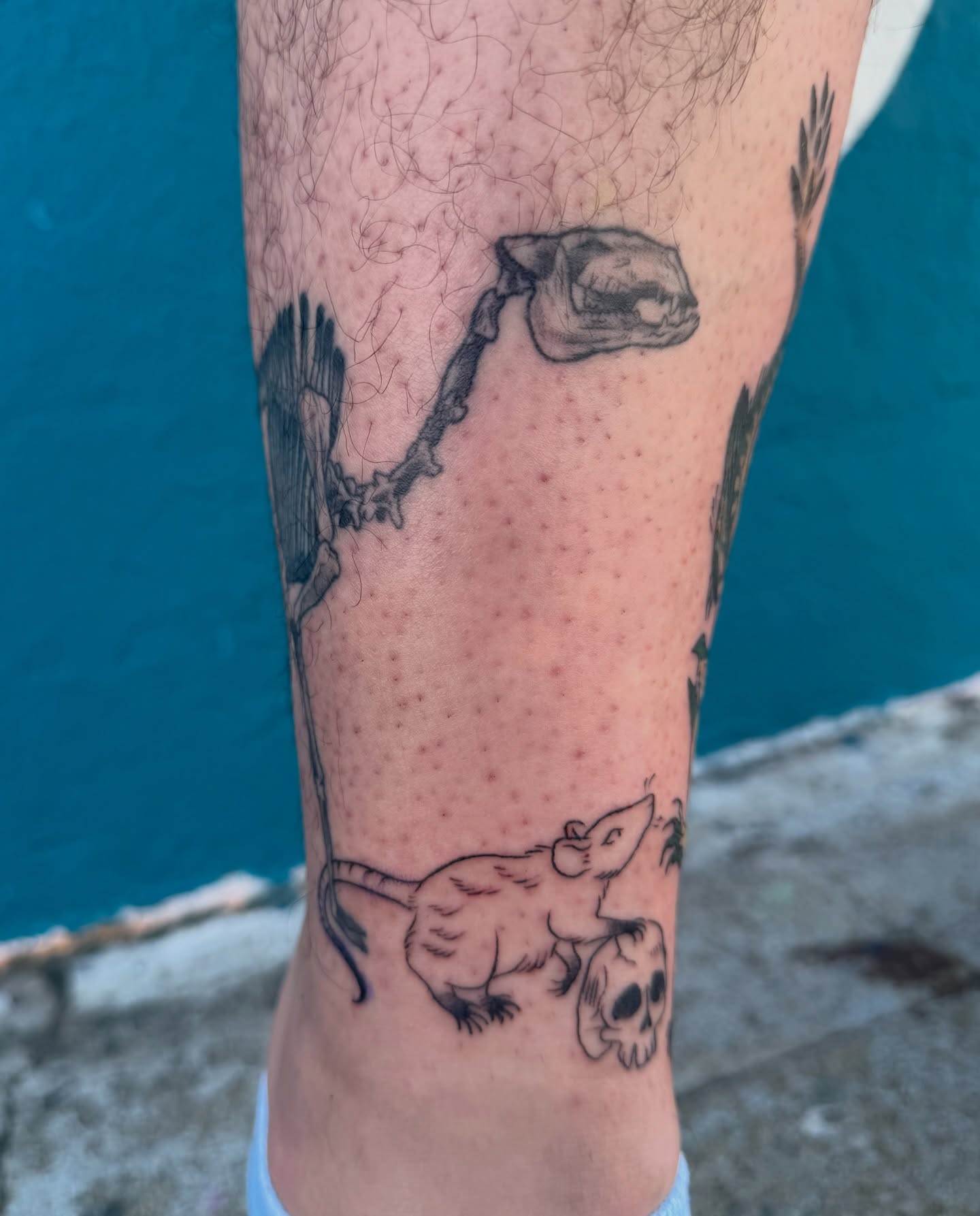 Dinosaur and skull black and grey tattoo on the forearm by Roswell Orellana 👽🛸