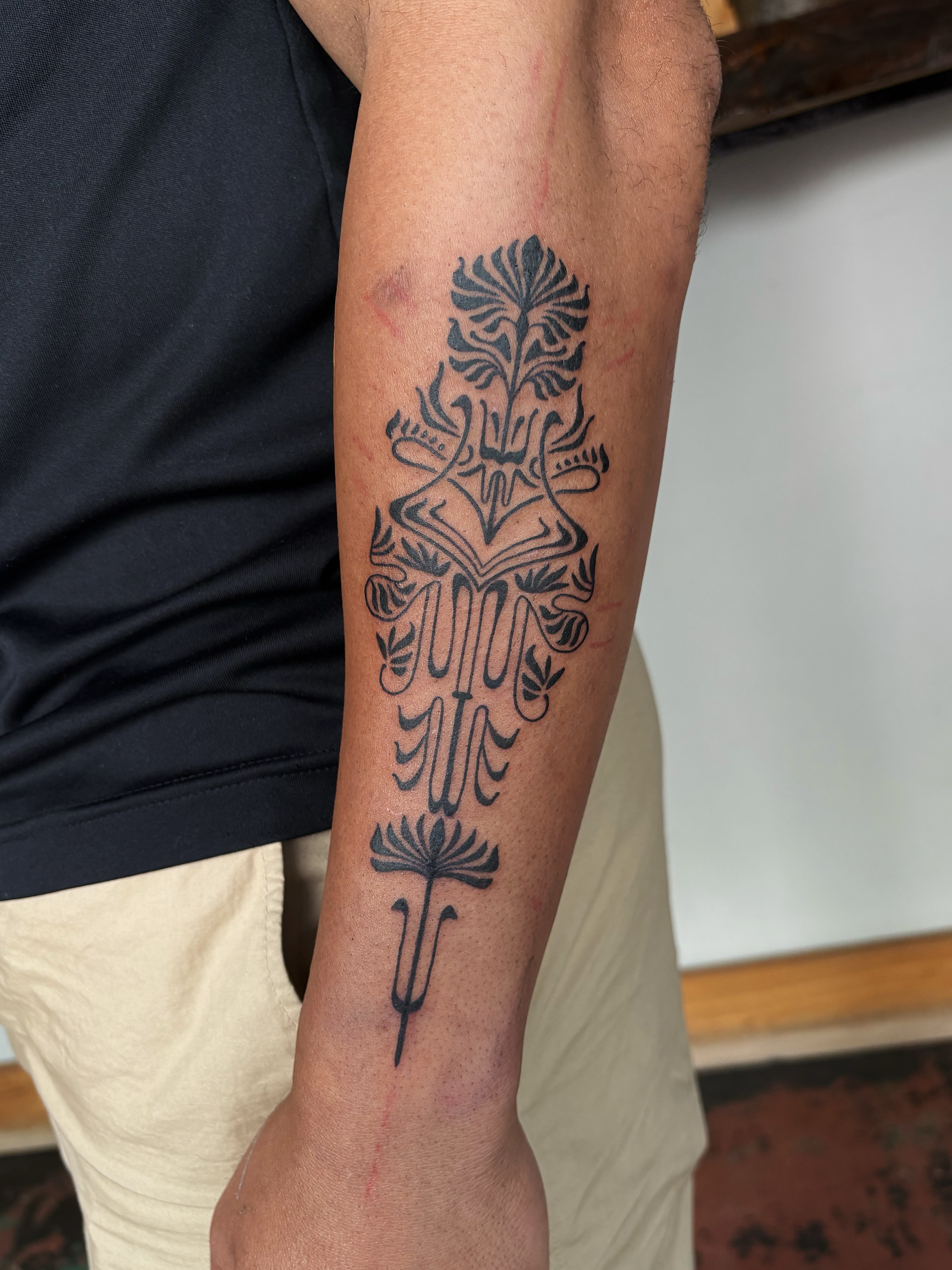Floral design black and grey tattoo on the forearm by Abigail, San Francisco, California