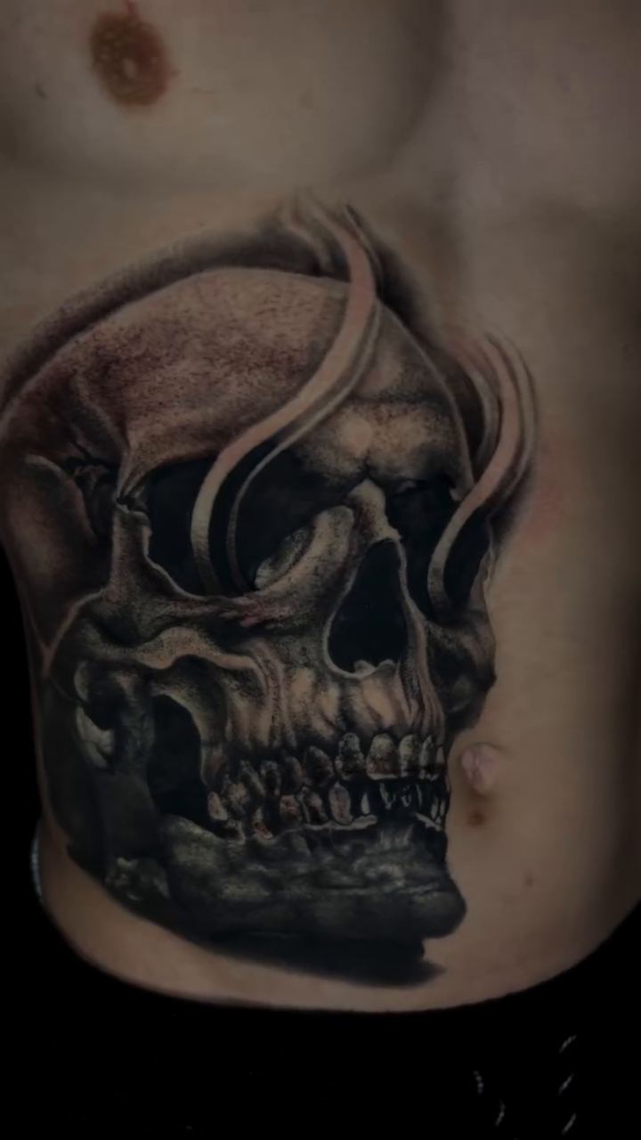 Skull with smoke realism tattoo on the chest by @_frankyvee