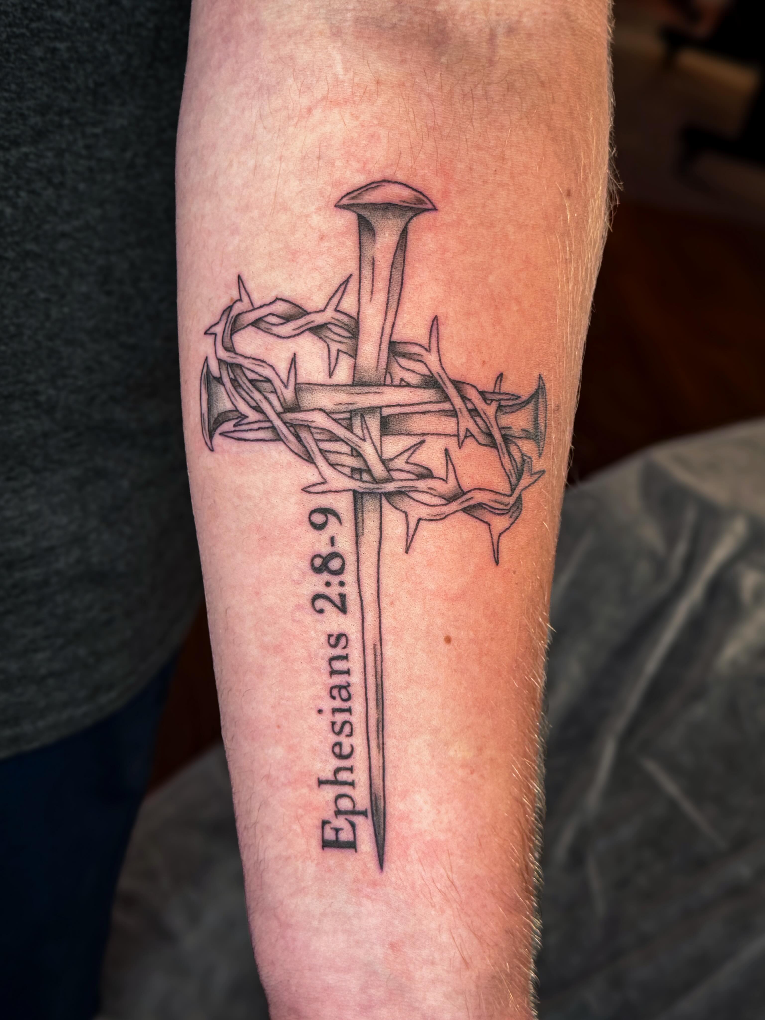 Cross with thorns black and grey tattoo on the forearm by Ash✨