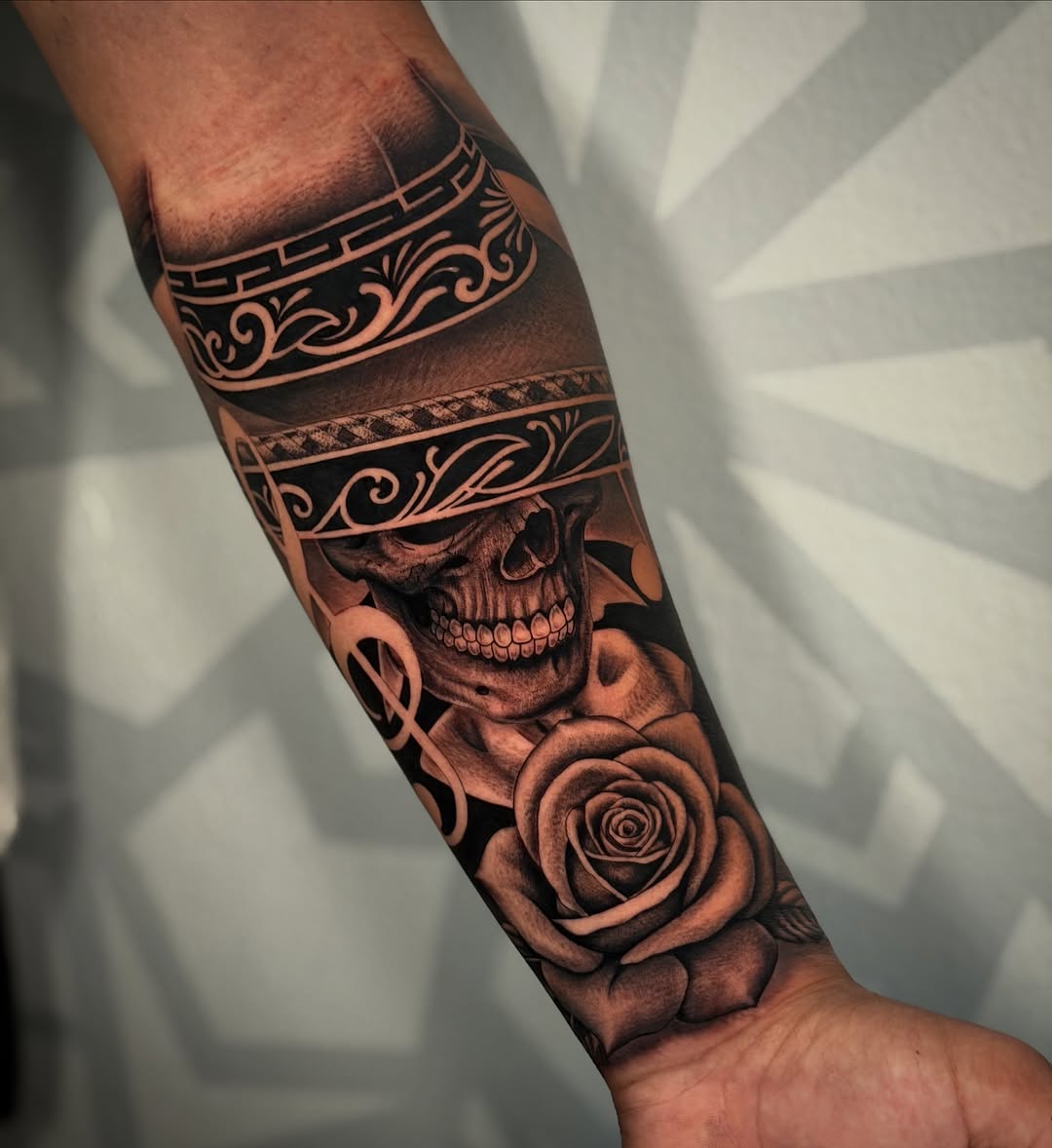 Skull with sombrero and rose realism tattoo on the forearm by Las Vegas Tattoo Artist