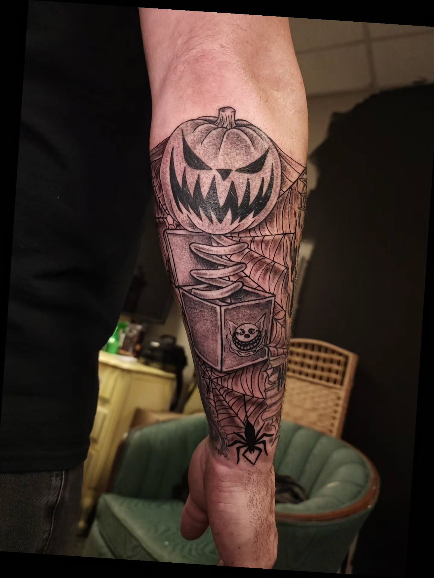 Pumpkin jack-o'-lantern black and grey tattoo on the forearm by xavia
