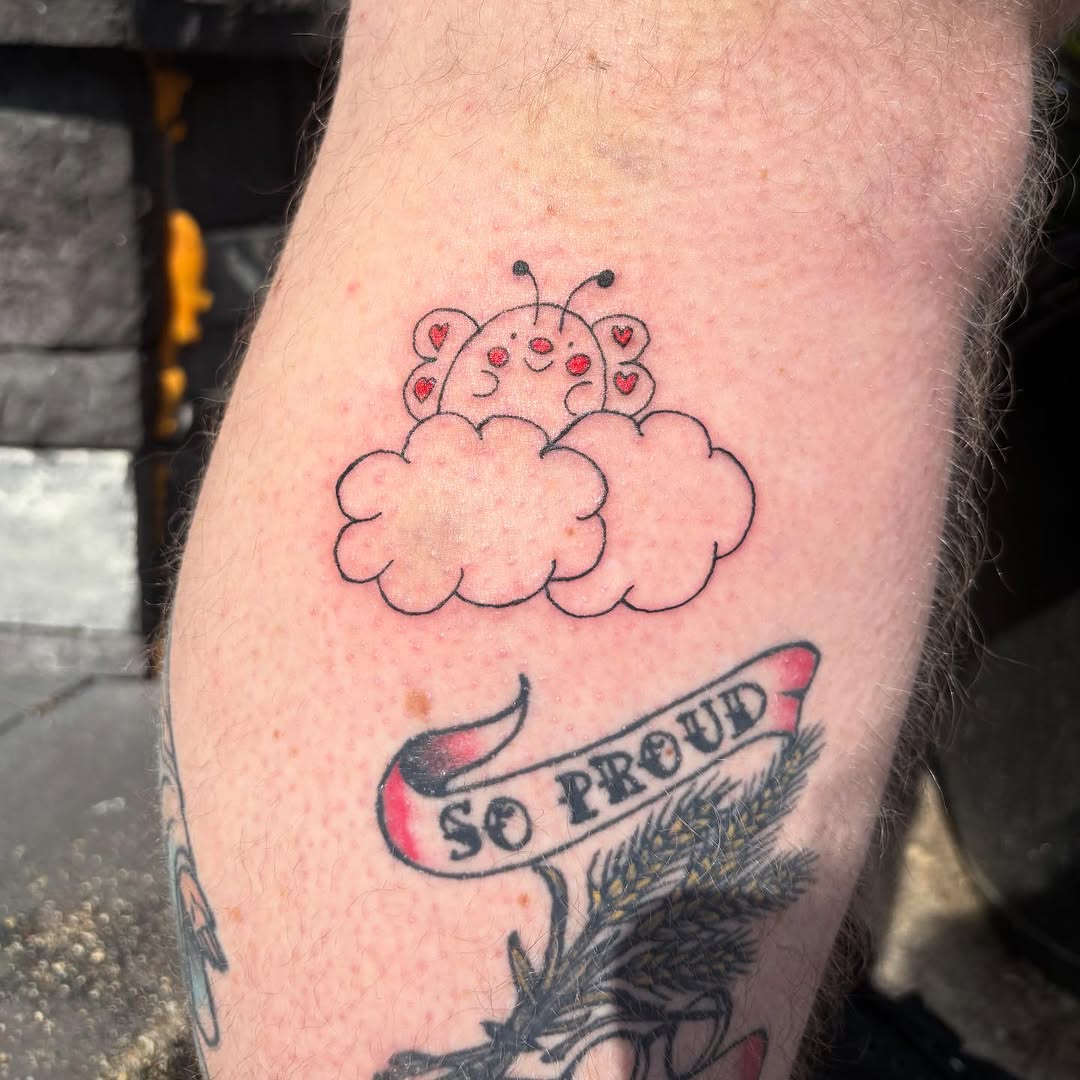 Ladybug on clouds ignorant tattoo on the forearm by riley