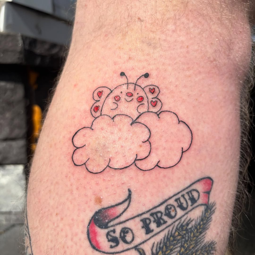 Ladybug on a cloud ignorant tattoo on the forearm by riley