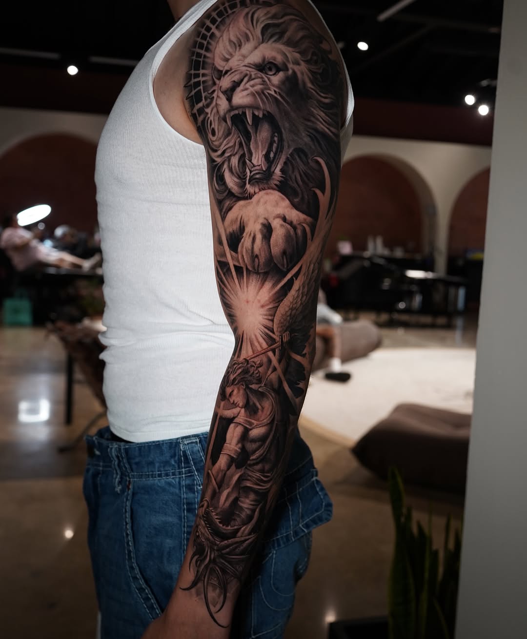 Lion and warrior Japanese tattoo on the forearm by Grace P