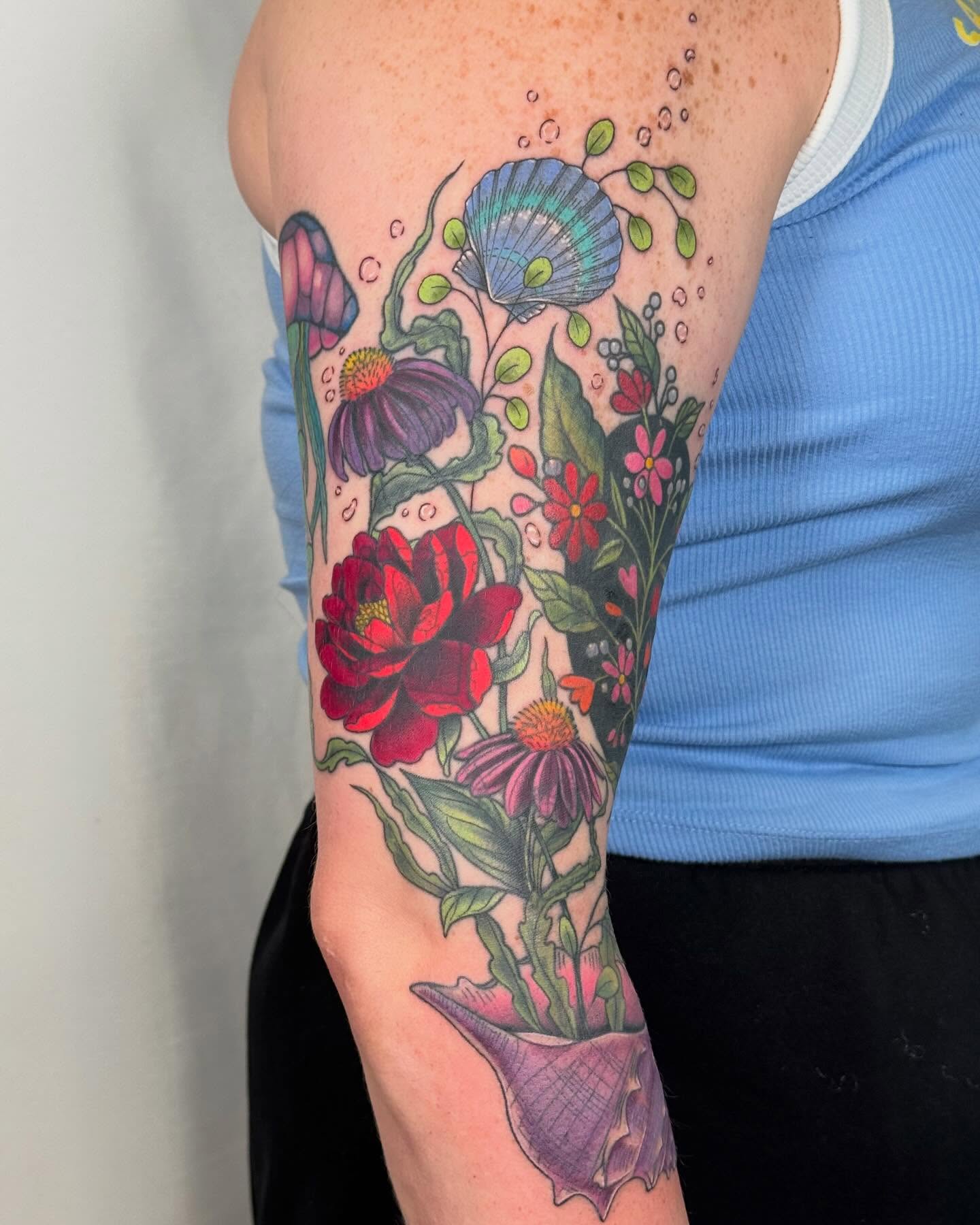 Floral bouquet American traditional tattoo on the forearm by Larkin Resler