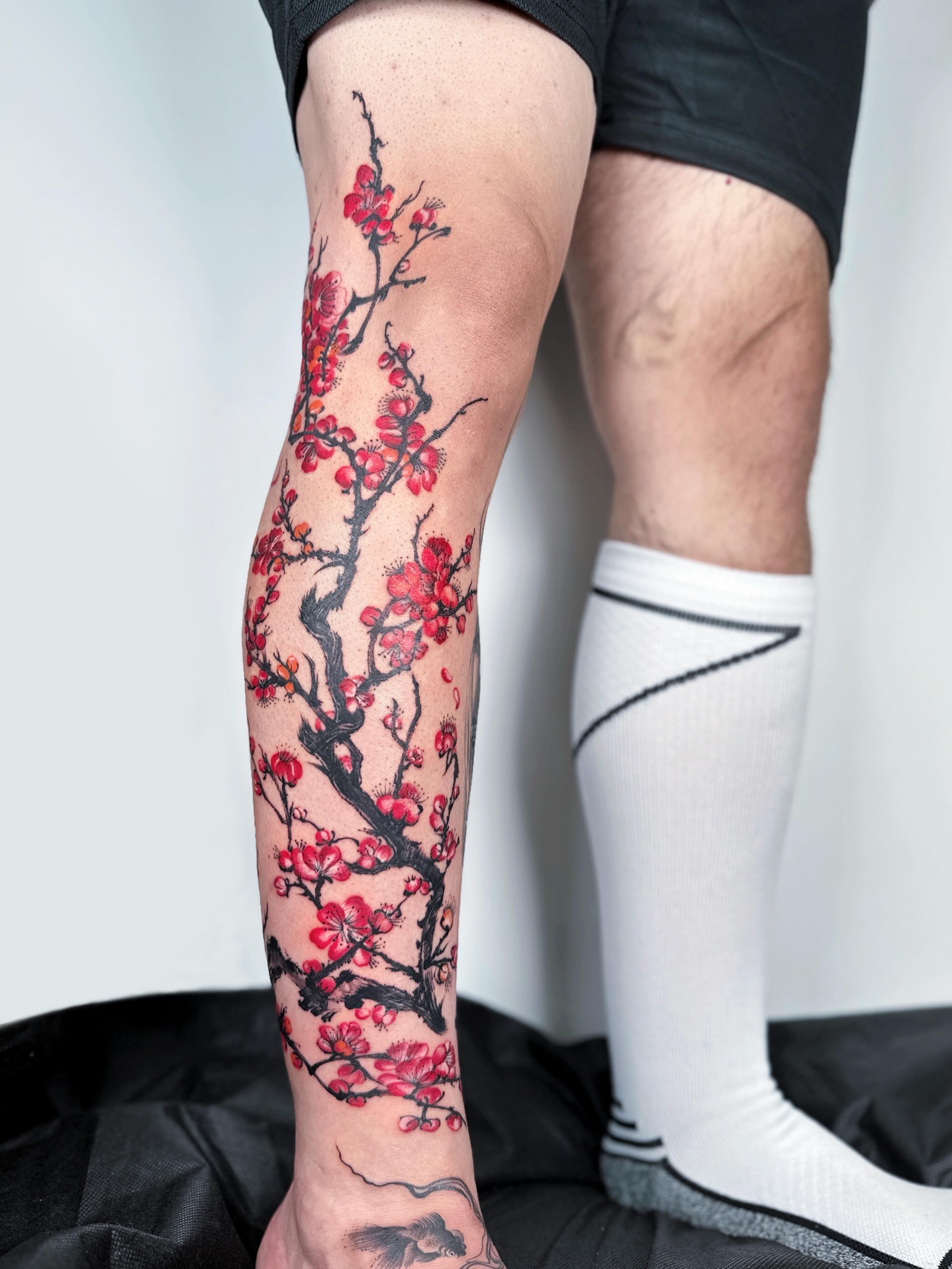 Cherry blossom branch japanese irezumi tattoo on the calf by Jiang_Tattooer
