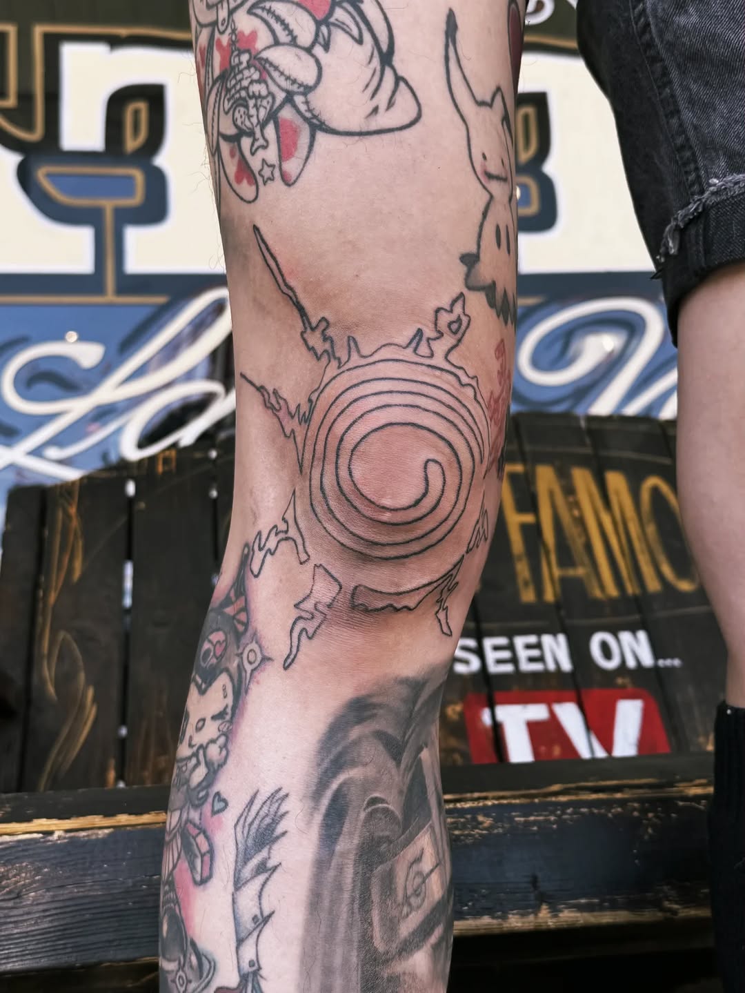 Spiral sunburst tribal tattoo on the forearm by Cielle