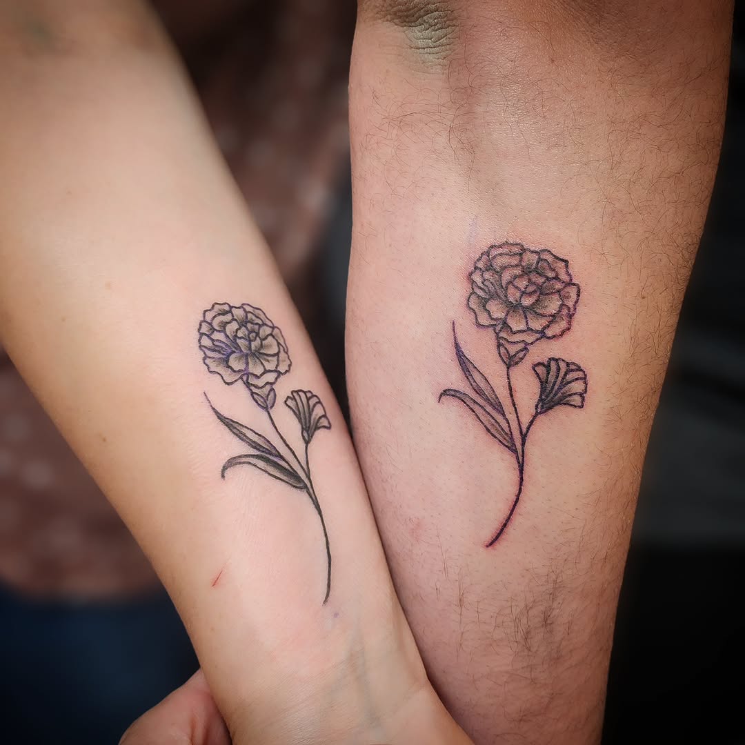 Flower fine line tattoo on the forearm by Anntonietta Borzacchiello