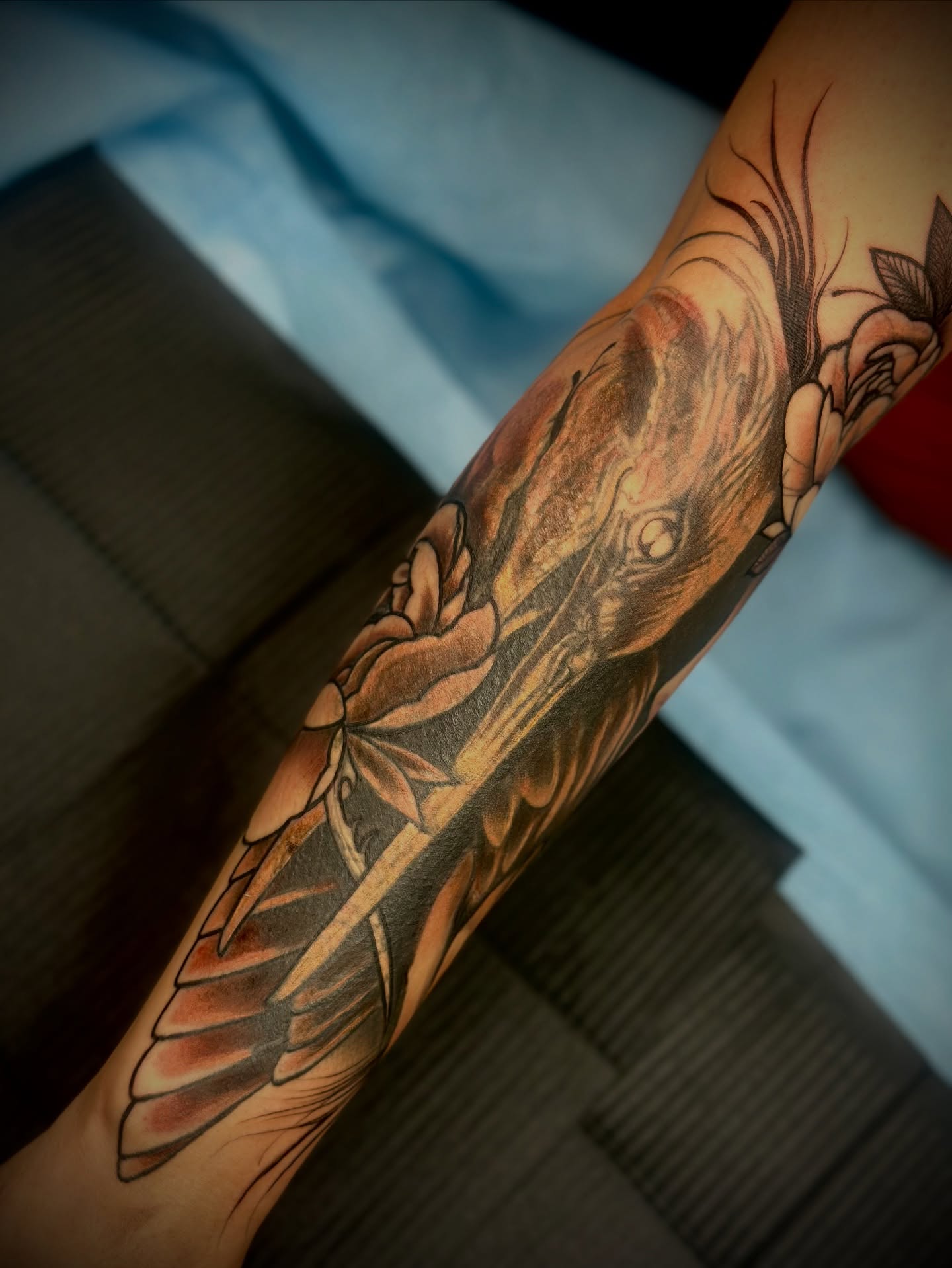 Bird and rose American traditional tattoo on the forearm by Feliz Manzanedo, Prescott, Arizona