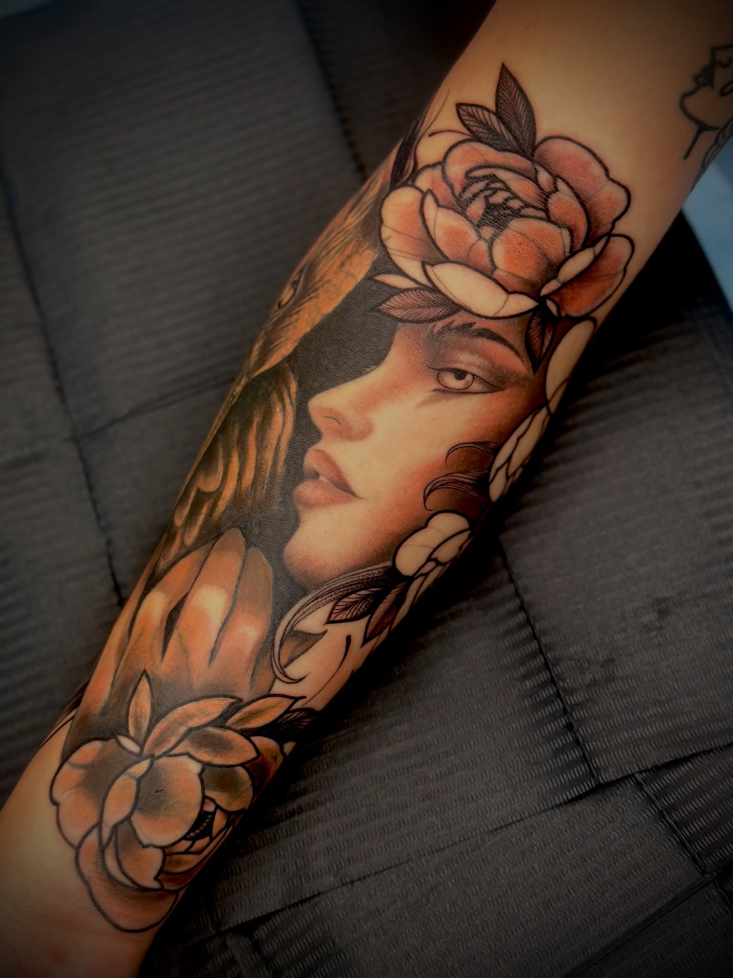 Woman with flowers American traditional tattoo on the forearm by Feliz Manzanedo, Prescott, Arizona