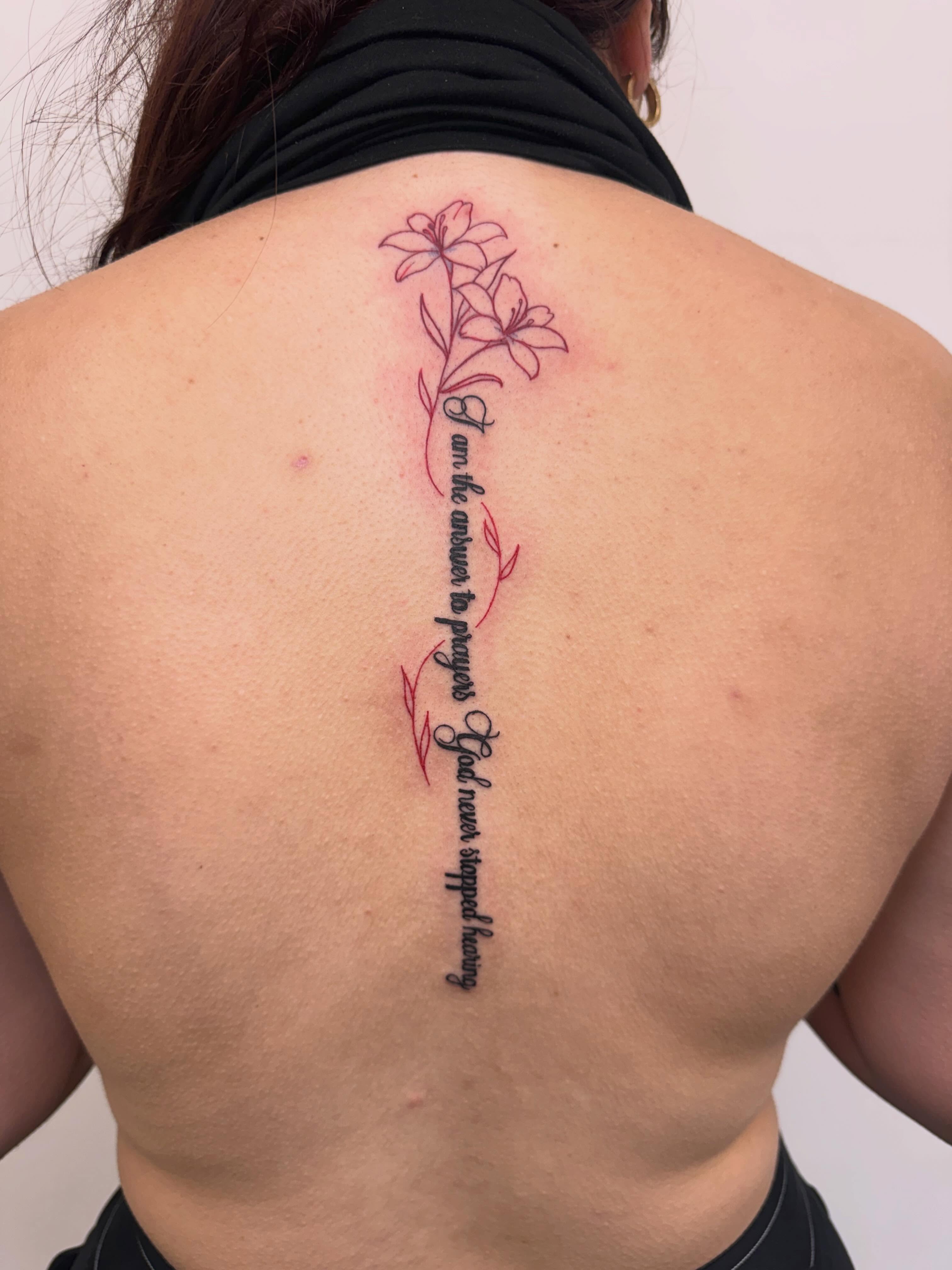 Script lettering lettering script tattoo on the back by Angela Nery, South Jordan, Utah