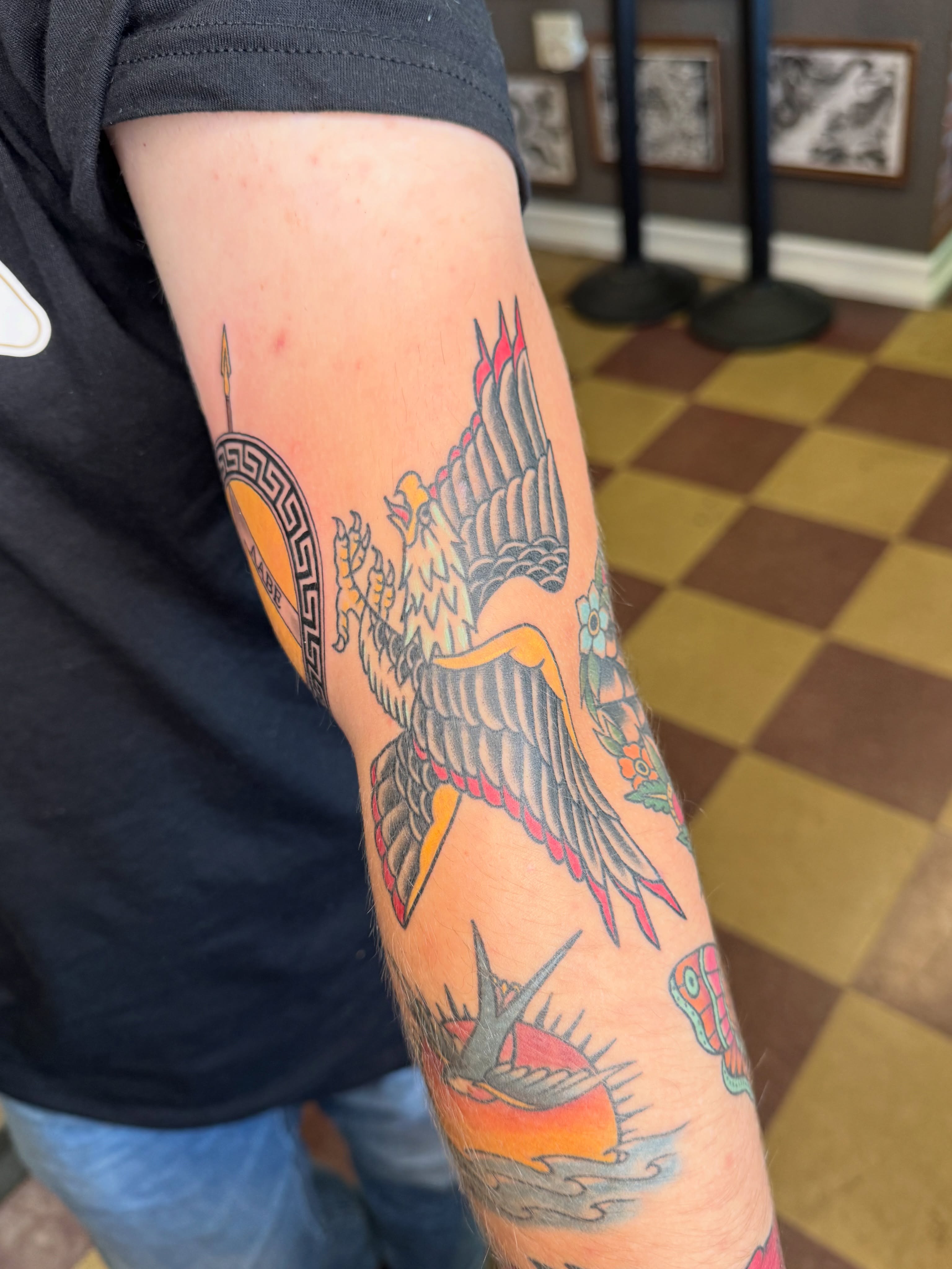 Eagle American traditional tattoo on the forearm by Cora Phelps