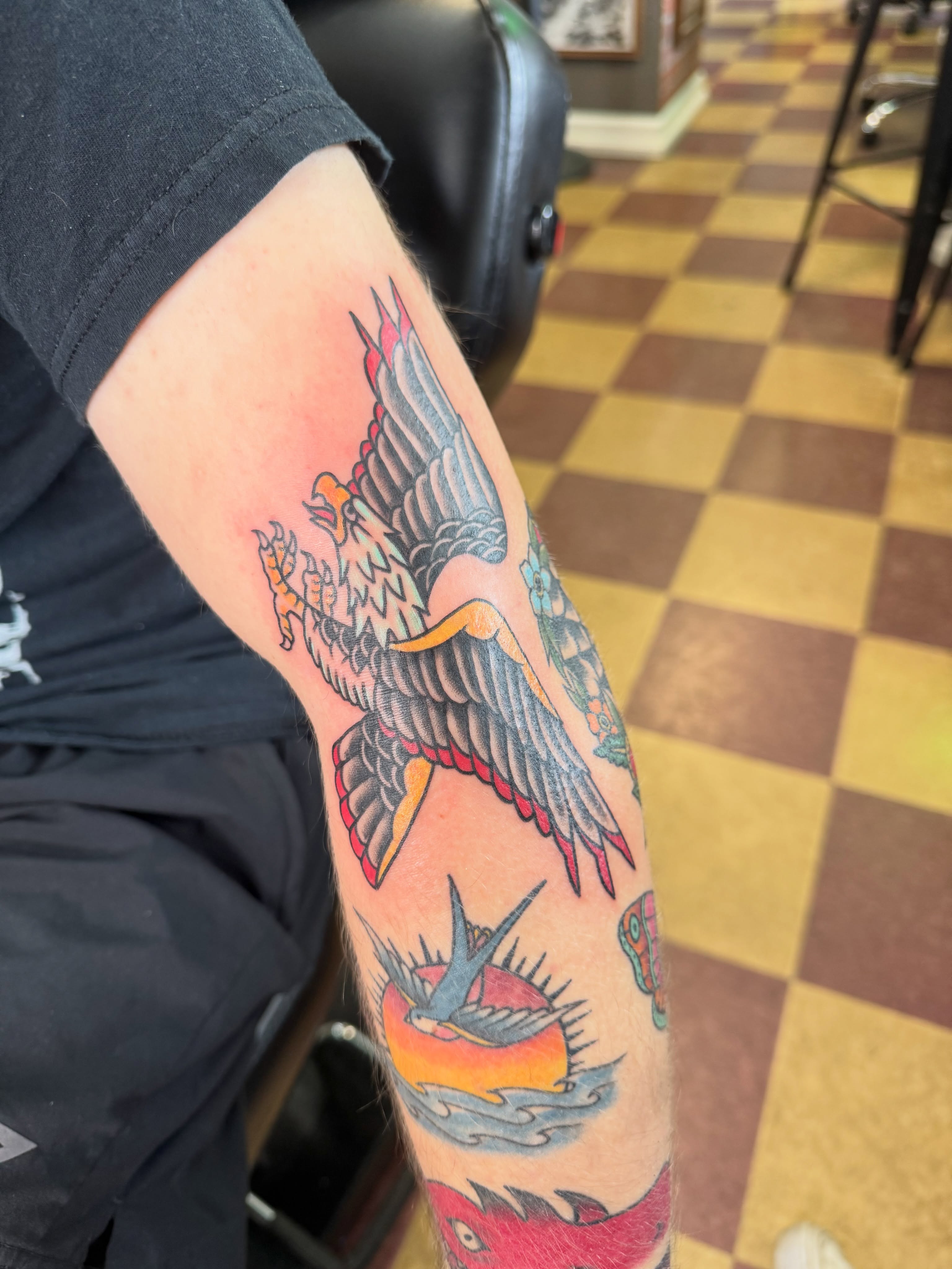Eagle American traditional tattoo on the forearm by Cora Phelps