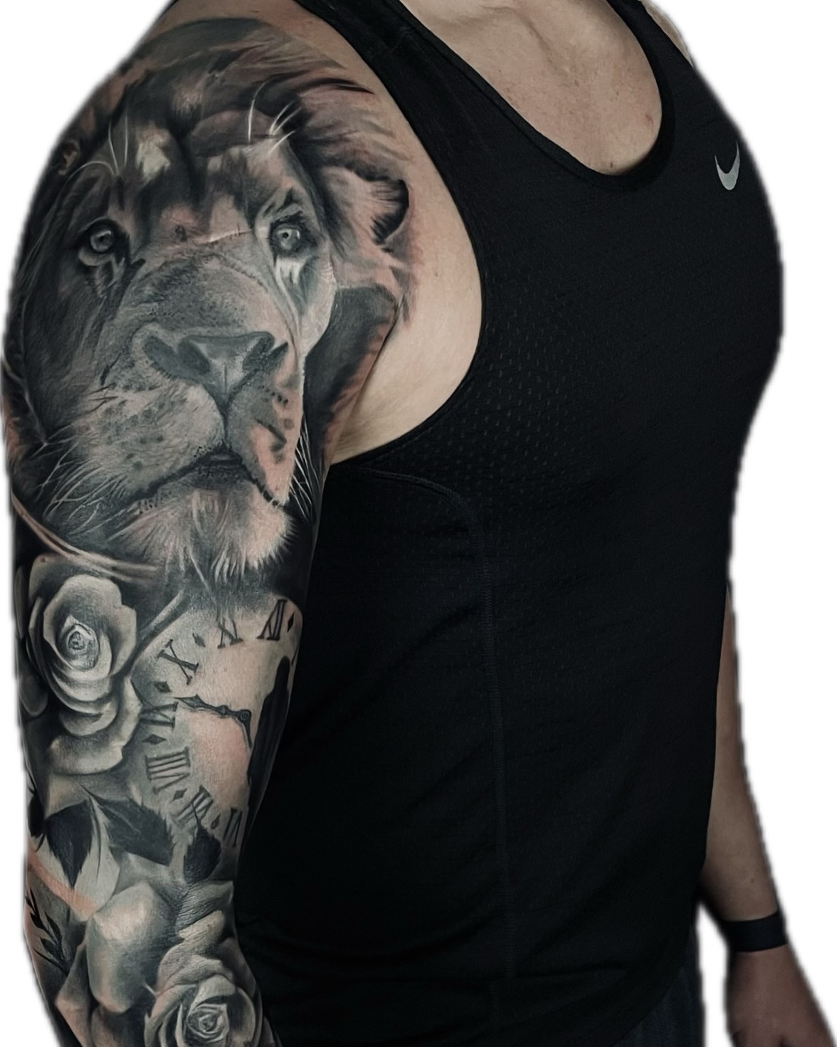 Lion realism tattoo on the upper arm by Levi Tattoo Artist, Utah