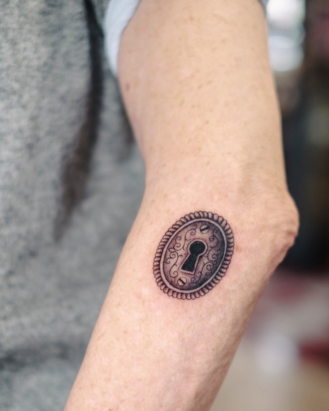 Keyhole black and grey tattoo on the forearm by Dan Gilsdorf, Portland, Oregon