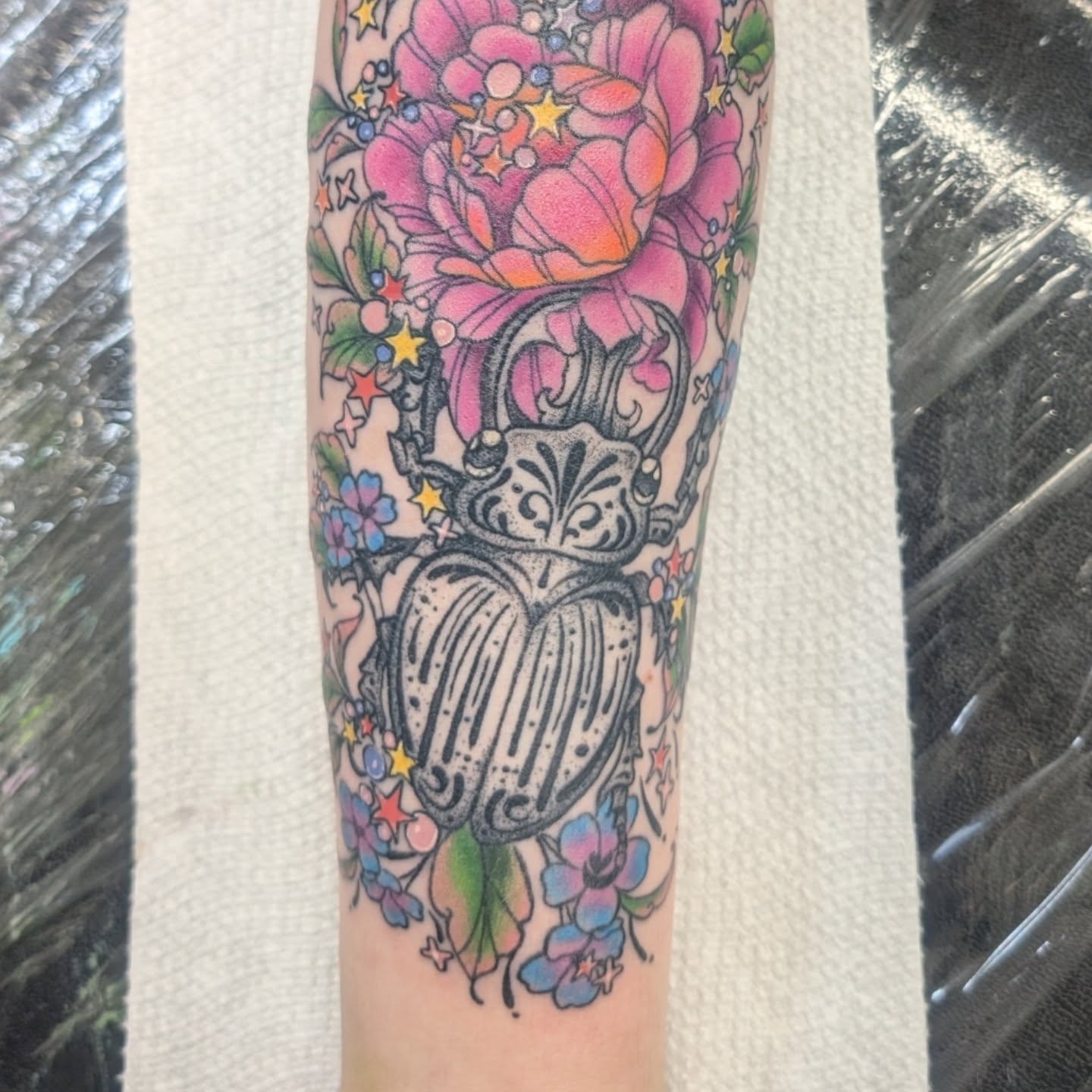 Scarab beetle American traditional tattoo on the forearm by Talia Zula, Loveland, Ohio