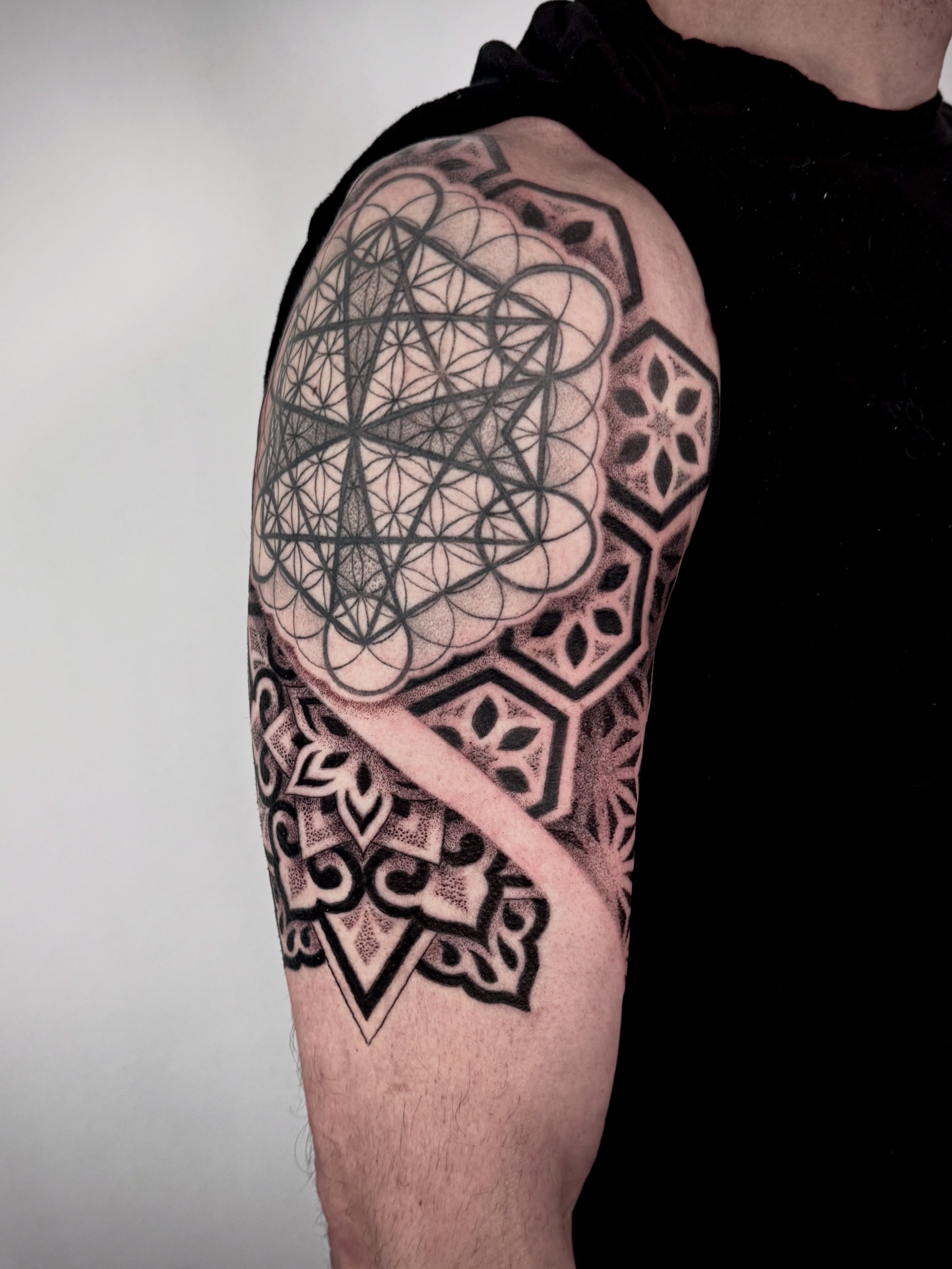 Geometric design geometric tattoo on the upper arm by Christine Hendricks, Denver, Colorado