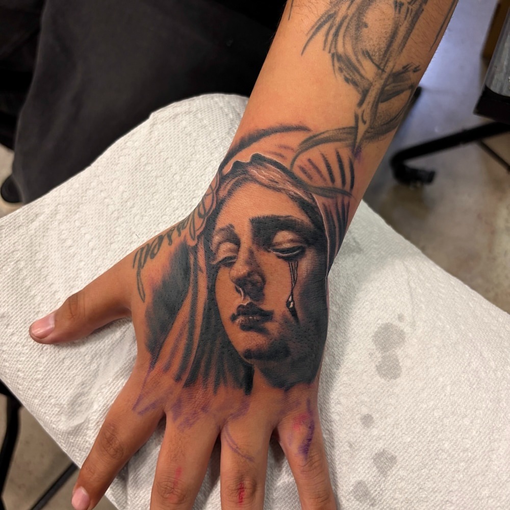 Man's face realism tattoo on the hand by Zeninkz