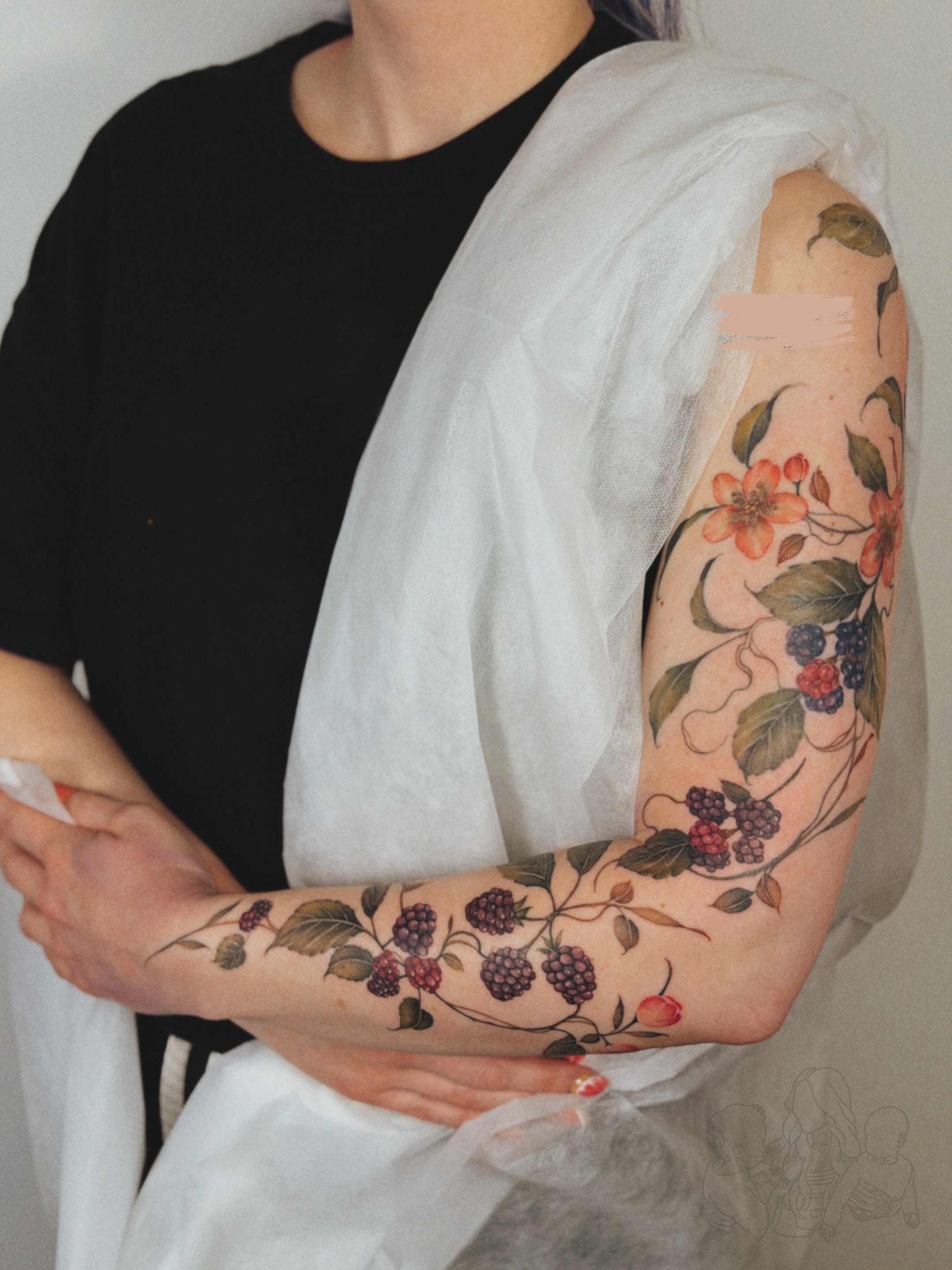 Berry vine realism tattoo on the forearm by Andrea Evangelista