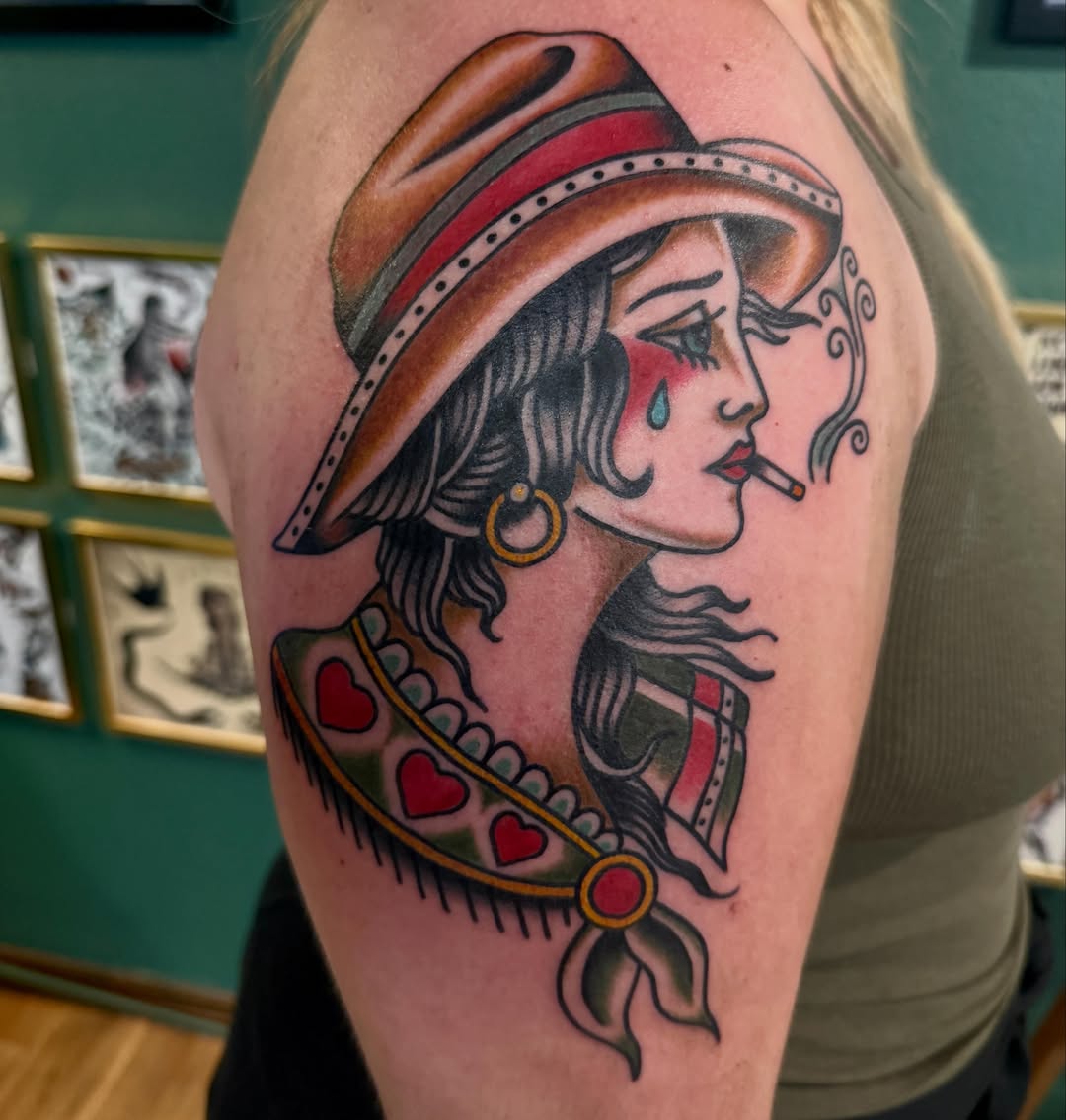 Woman smoking American traditional tattoo on the shoulder by Ryan Moraski, Colorado Springs, Colorado