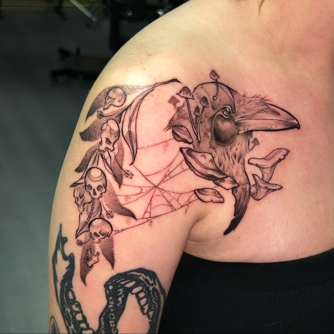 Crow and skulls geometric tattoo on the shoulder by Maara Martinez