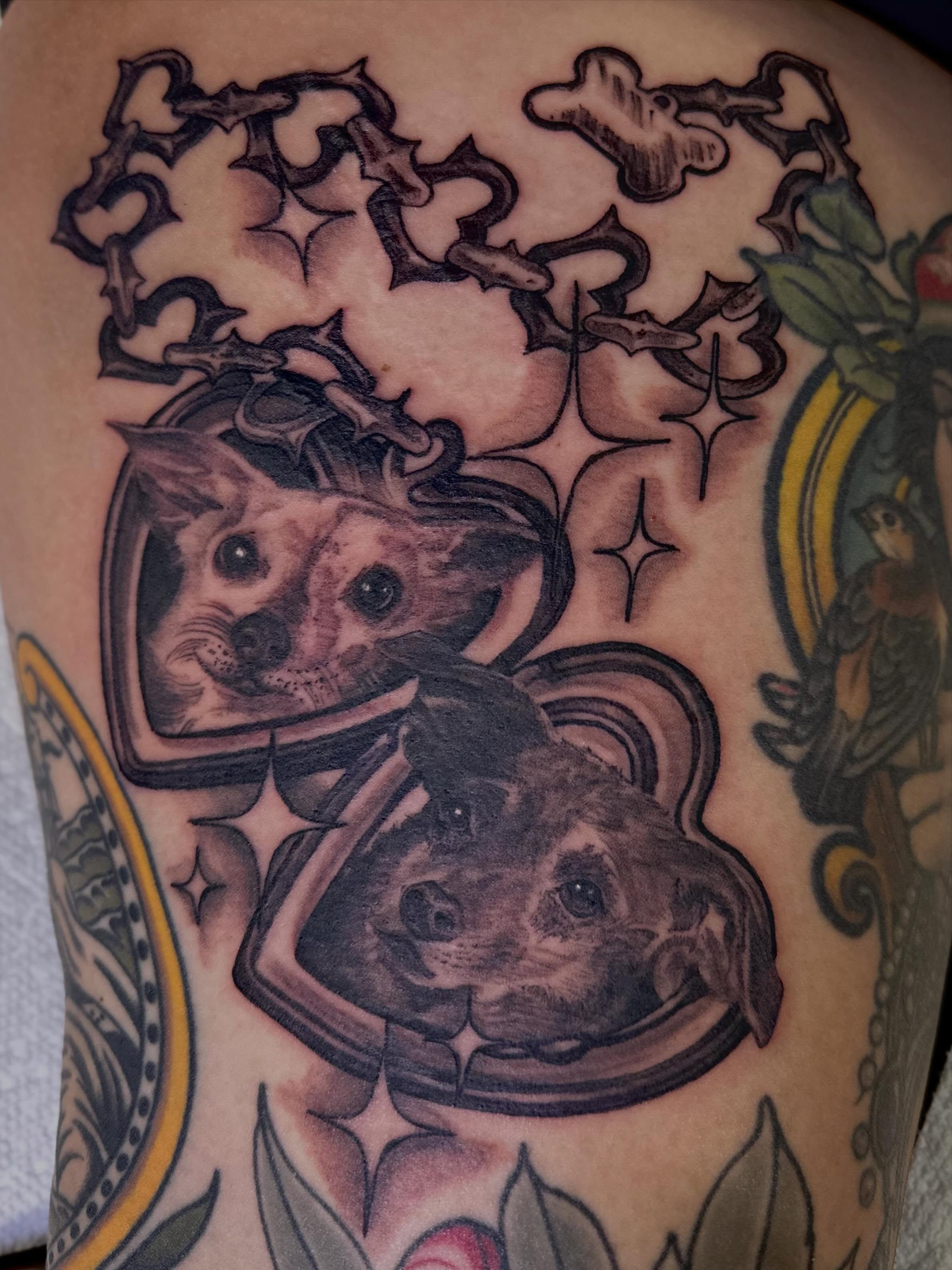 Dogs in space helmets American traditional tattoo on the shoulder by Mathilda Quynh