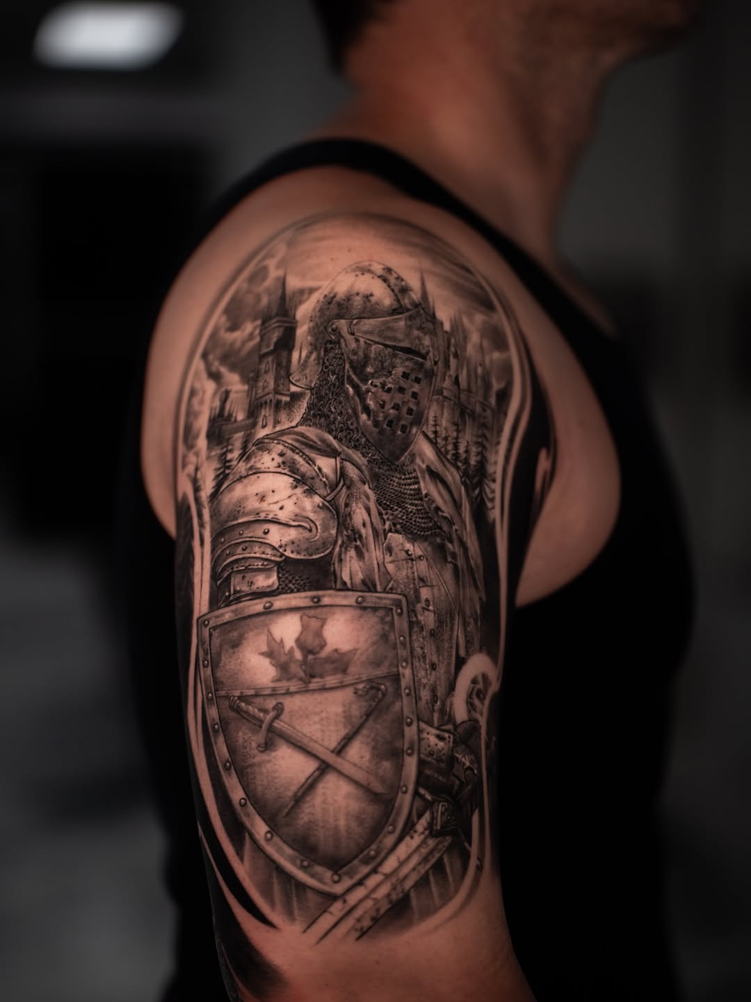 Knight in armor with shield realism tattoo on the shoulder by Andres Pabon Tattoo Artist