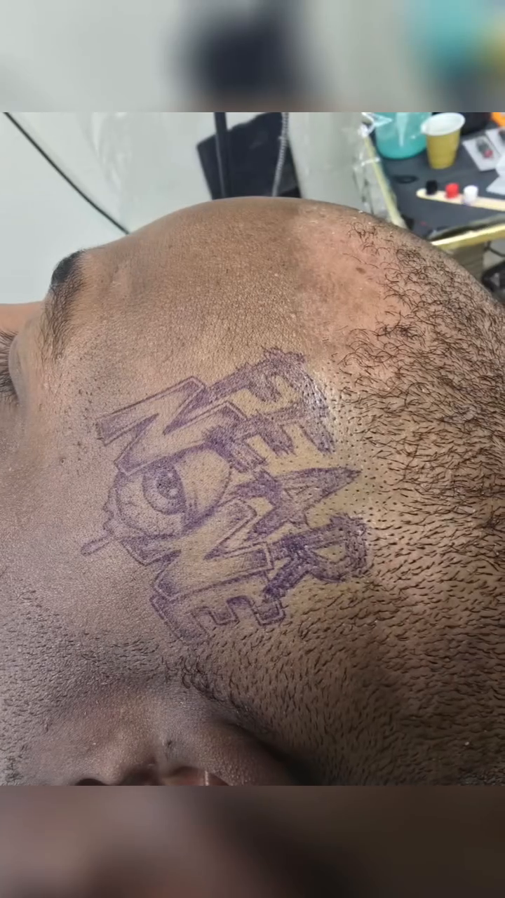 Fear None text tattoo on head tattoo on the head by Captain Michael Devious