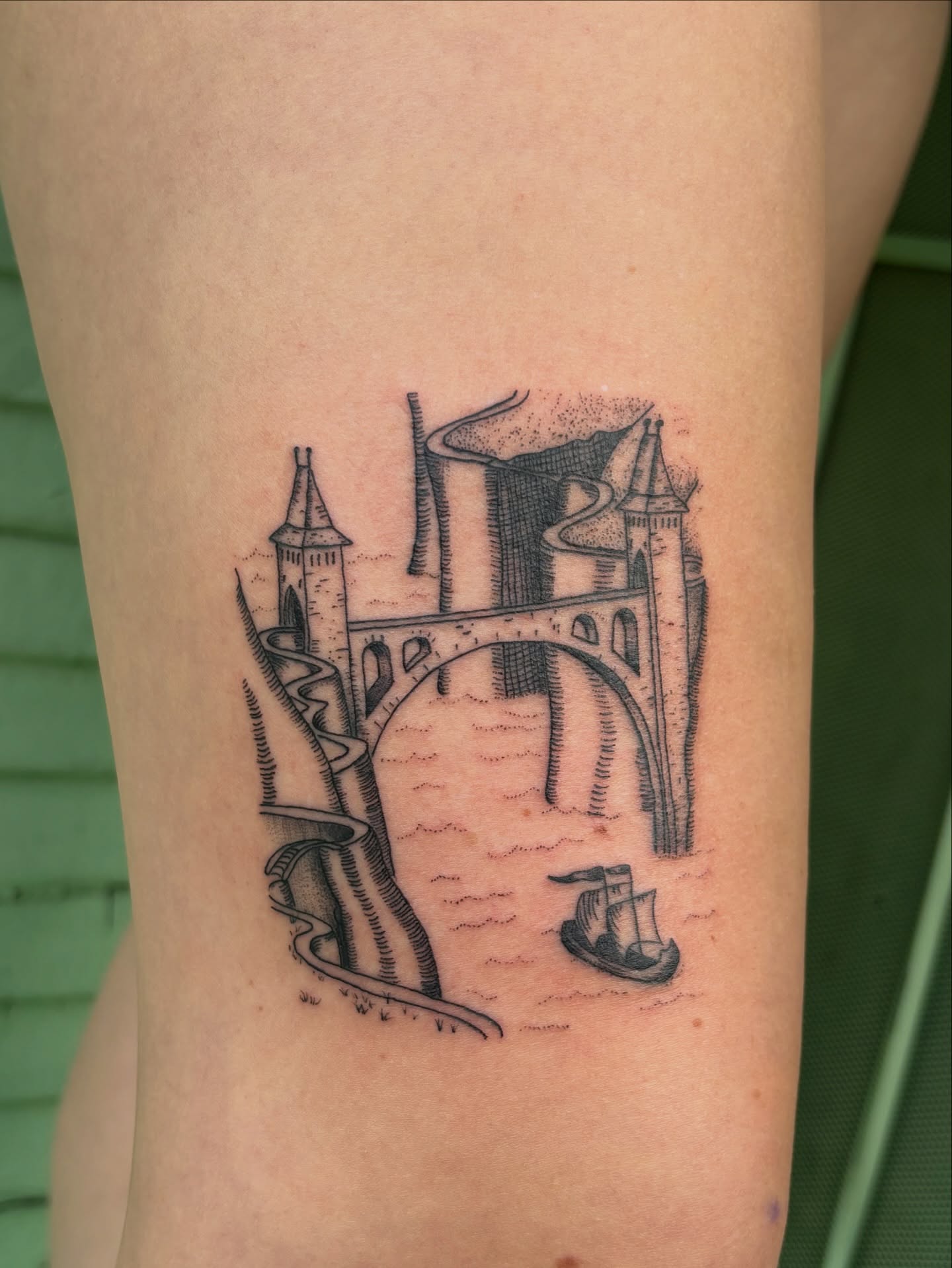 Bridge and castle black and grey tattoo on the forearm by carla sofia