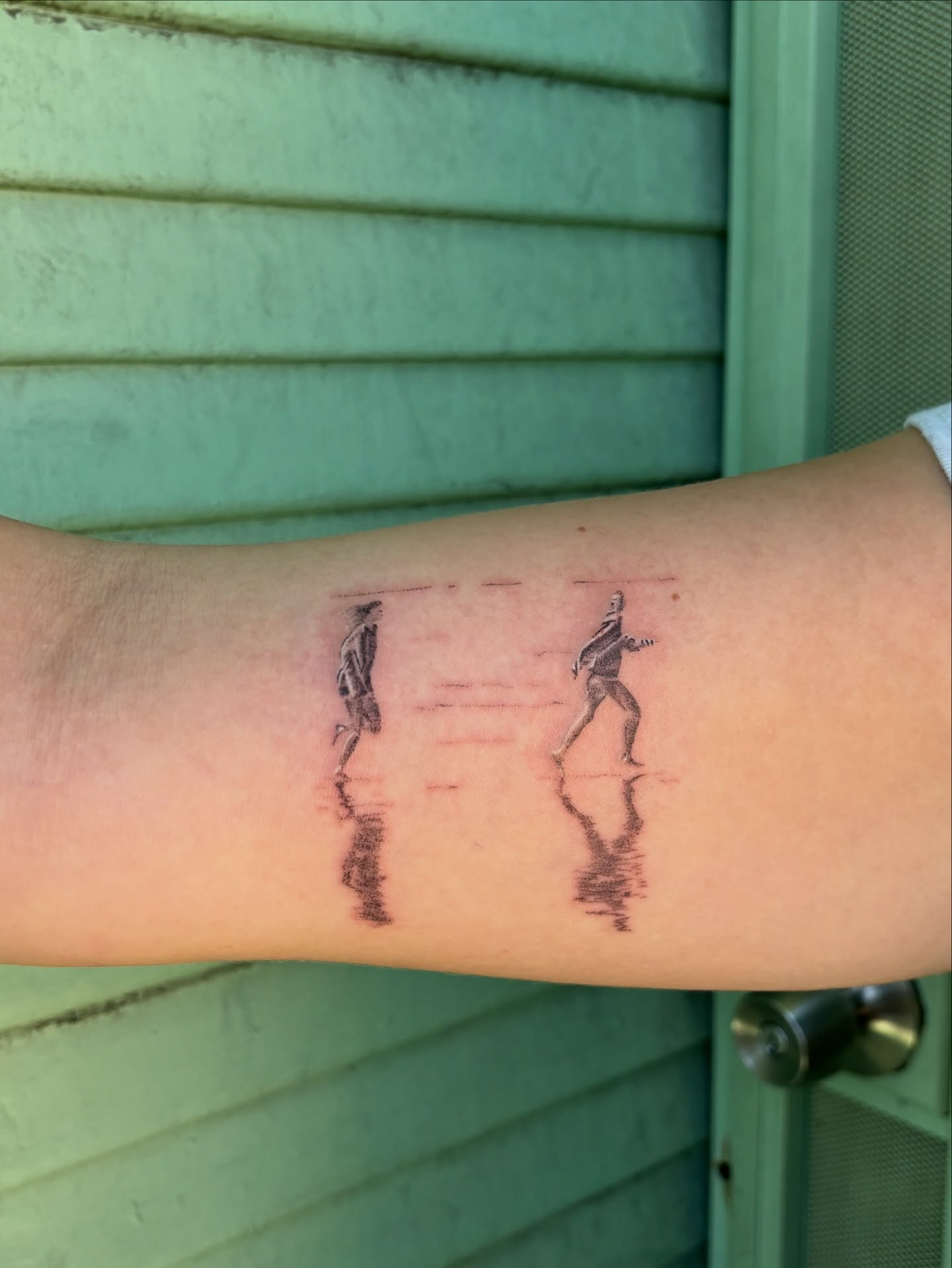 Dancers black and grey tattoo on the forearm by carla sofia
