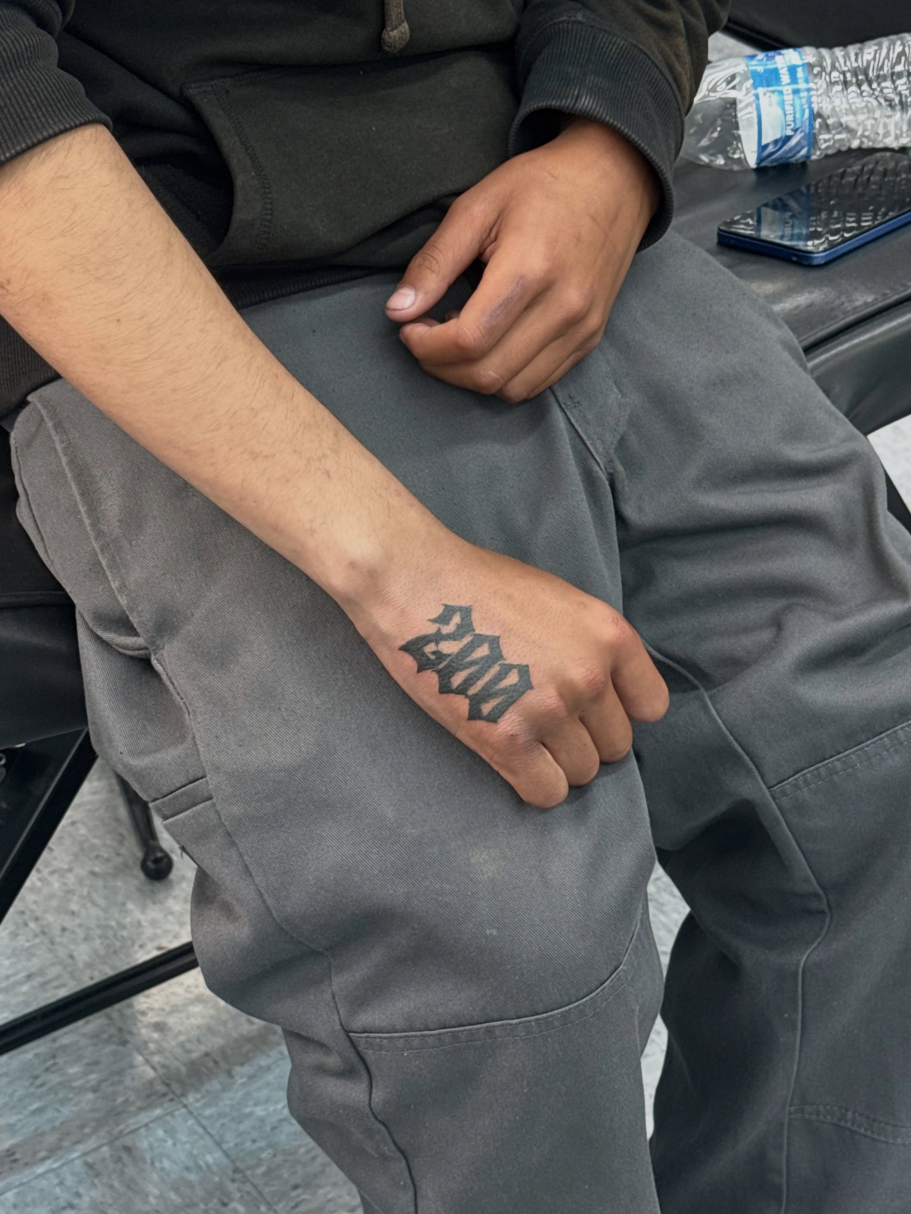 Number lettering script tattoo on the hand by ⠀Greave