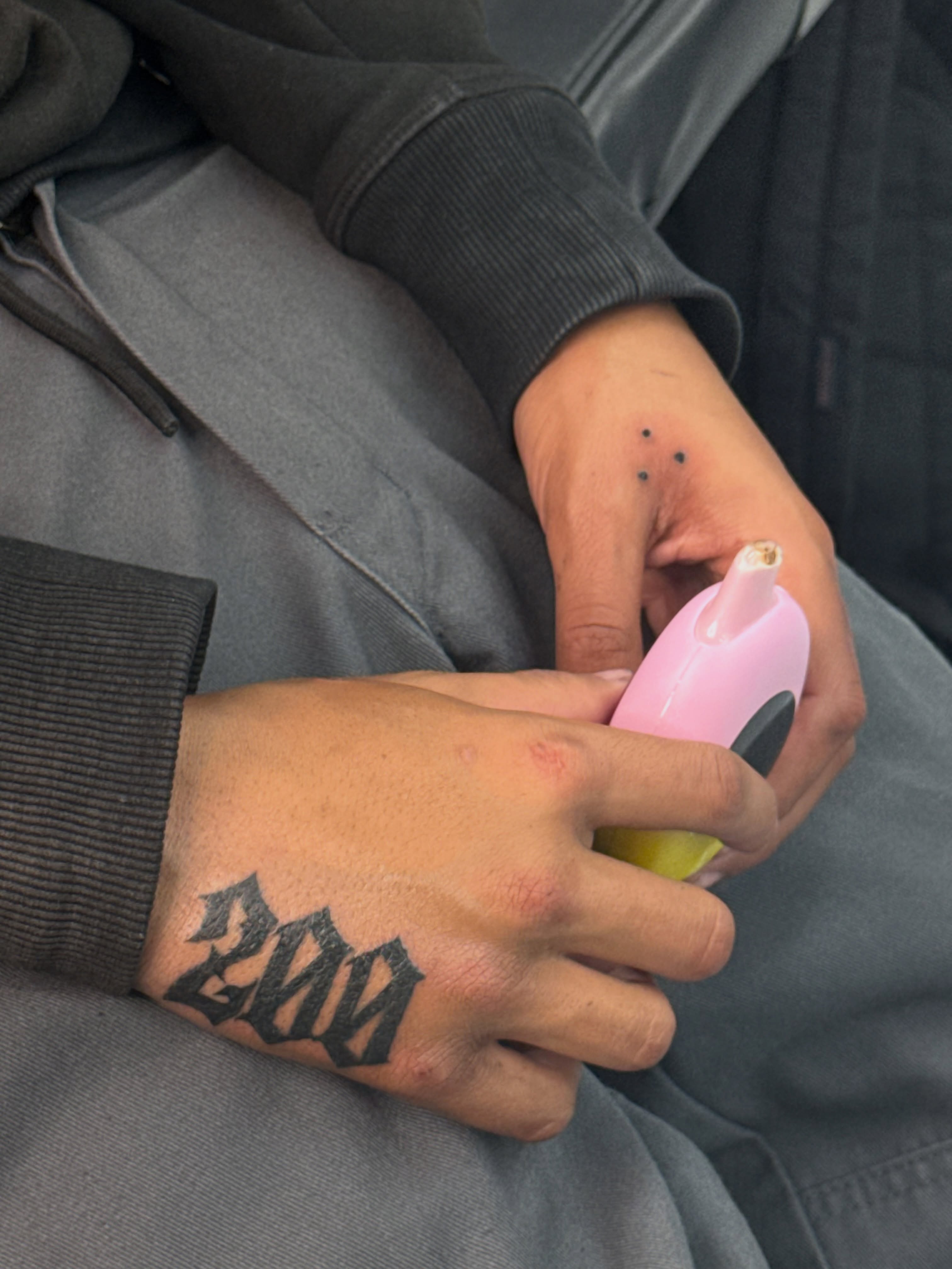 Number 200 black and grey tattoo on the hand by ⠀Greave