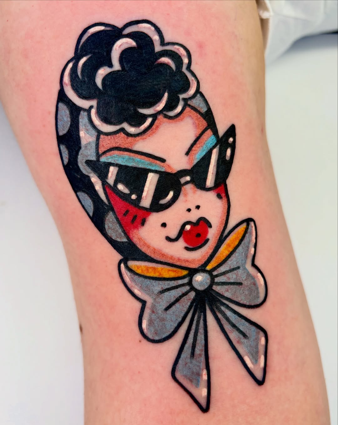 Woman with sunglasses American traditional tattoo on the forearm by Bella