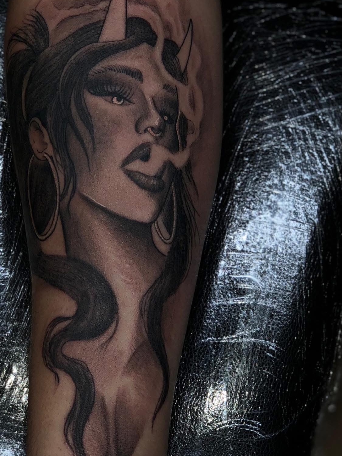 Woman with horns realism tattoo on the forearm by @divineink_nyc