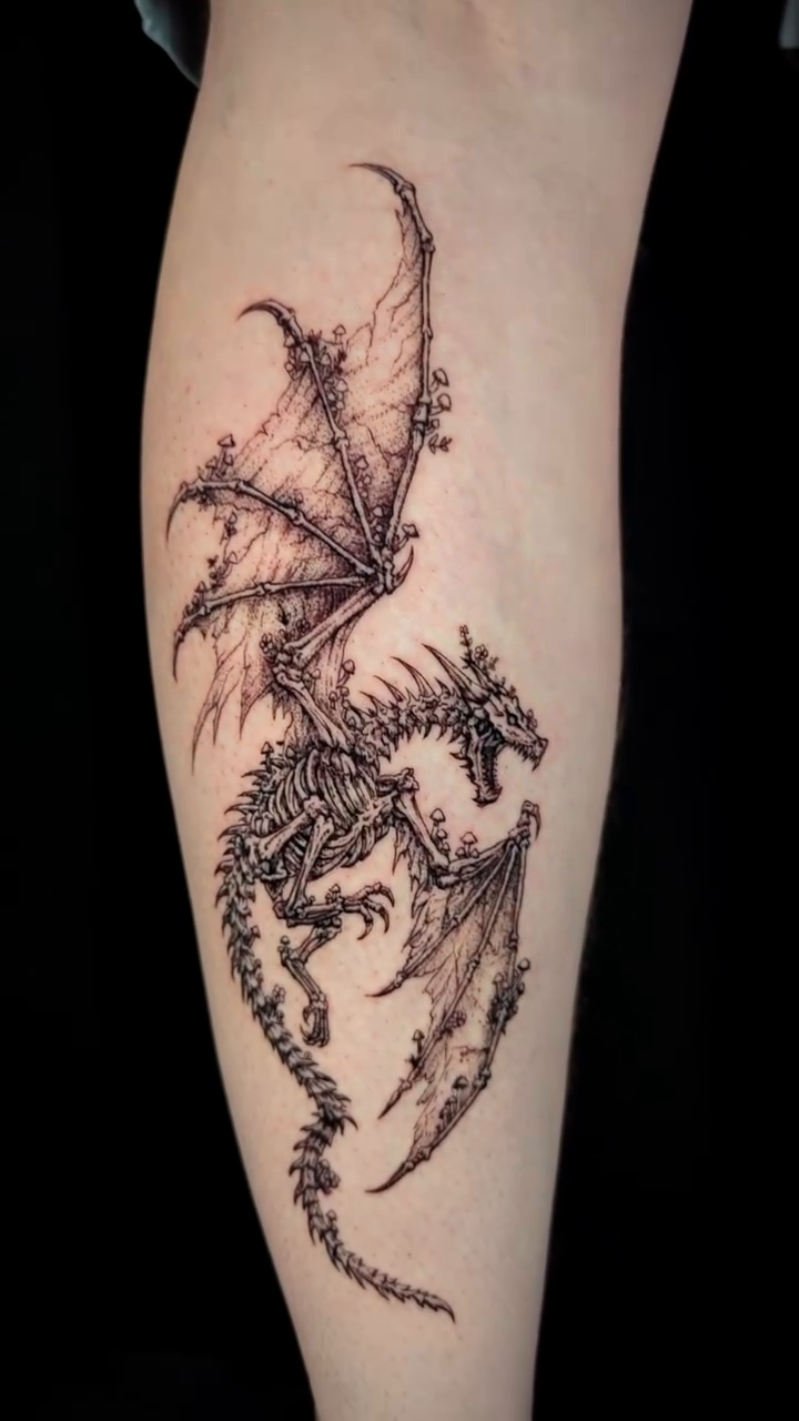 Dragon skeleton dark realism tattoo by Jessica Sheahan